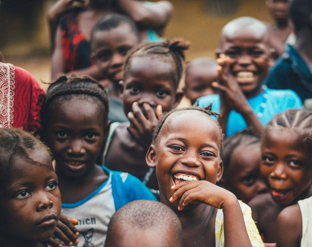 Haiti, smiling children, sunlit outdoor gathering, SD Desktop Wallpaper