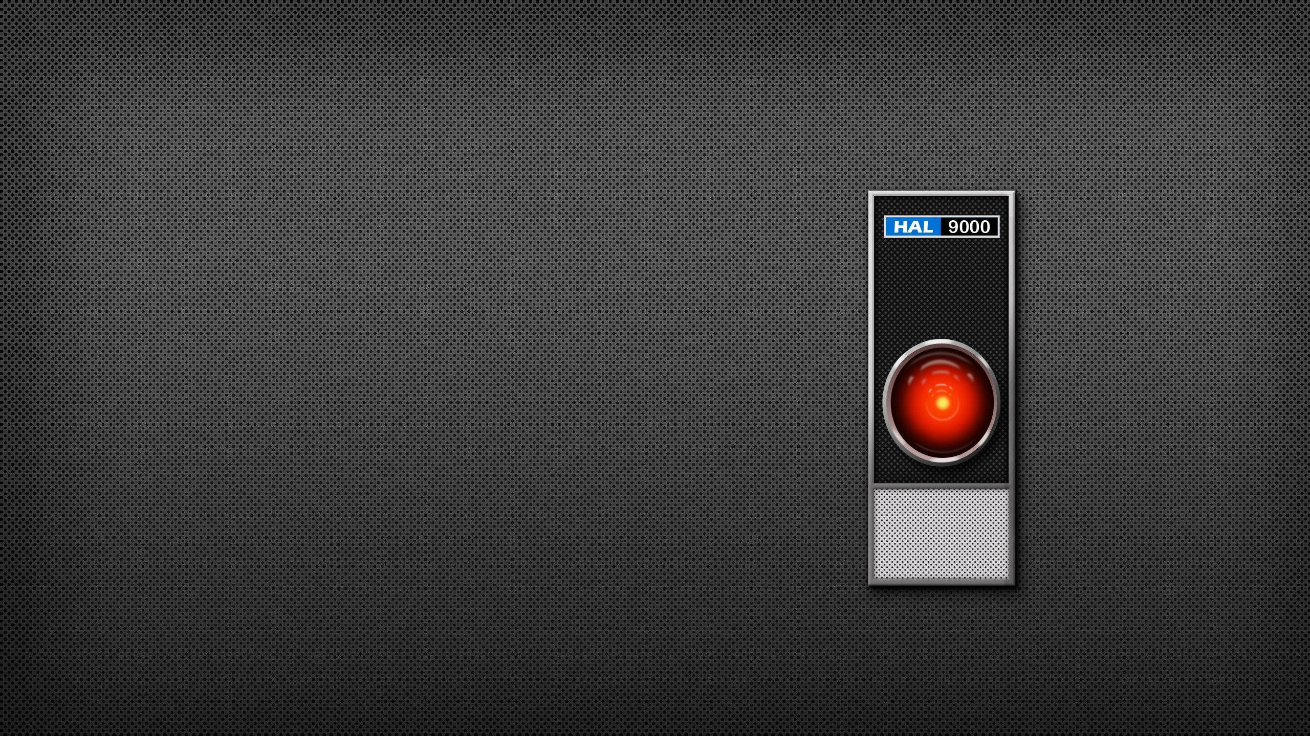 Hal 9000, glowing red eye, dark perforated metal background, 2K Desktop Wallpaper