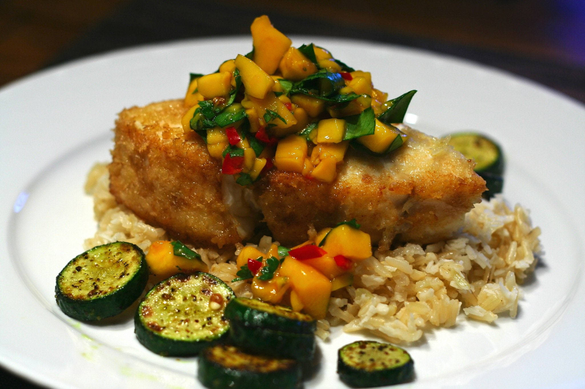 Traditional Spanish Fried Halibut, golden-brown breaded fish, vibrant mango salsa, Full HD Desktop Wallpaper