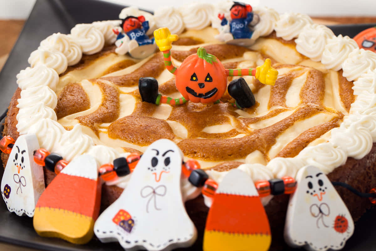 Halloween Cake, whipped cream spiderwebs, smiling jack-o'-lantern topper, SD Desktop Wallpaper