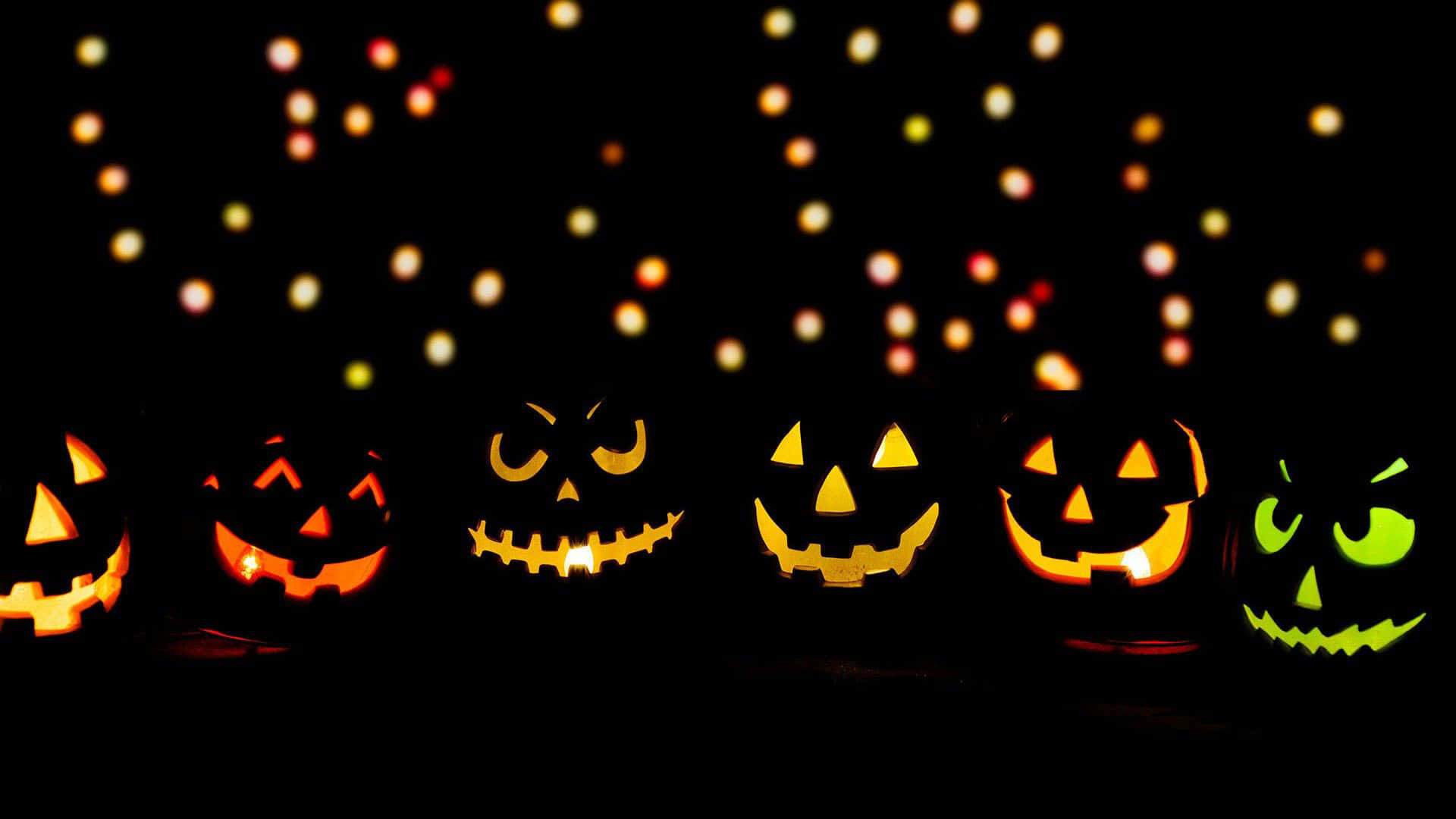 glowing jack-o'-lanterns, varied menacing expressions, dark backdrop, Full HD Desktop Wallpaper