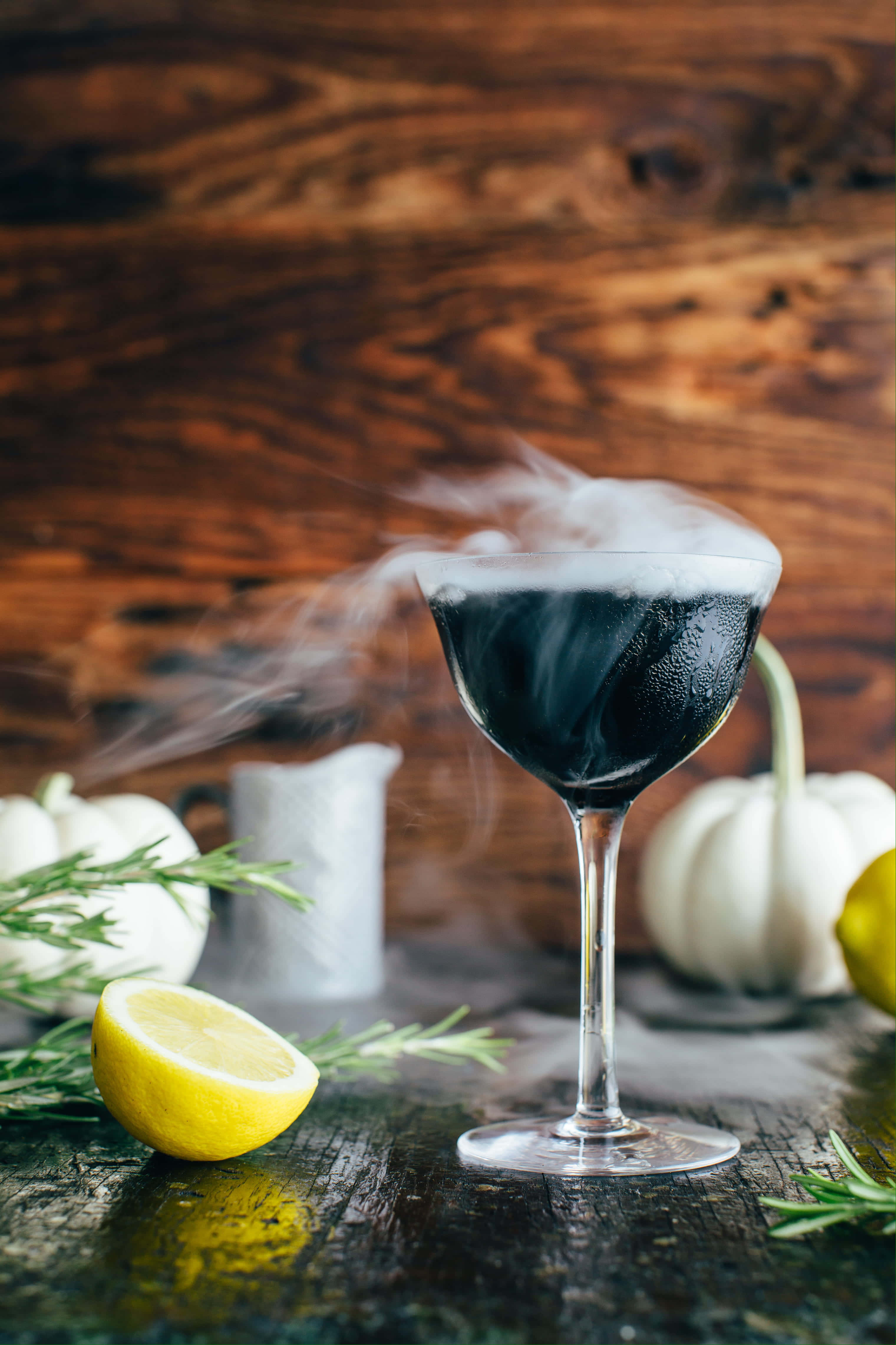 smoky black cocktail, coupe glass, rustic wooden table, 4K Phone Wallpaper
