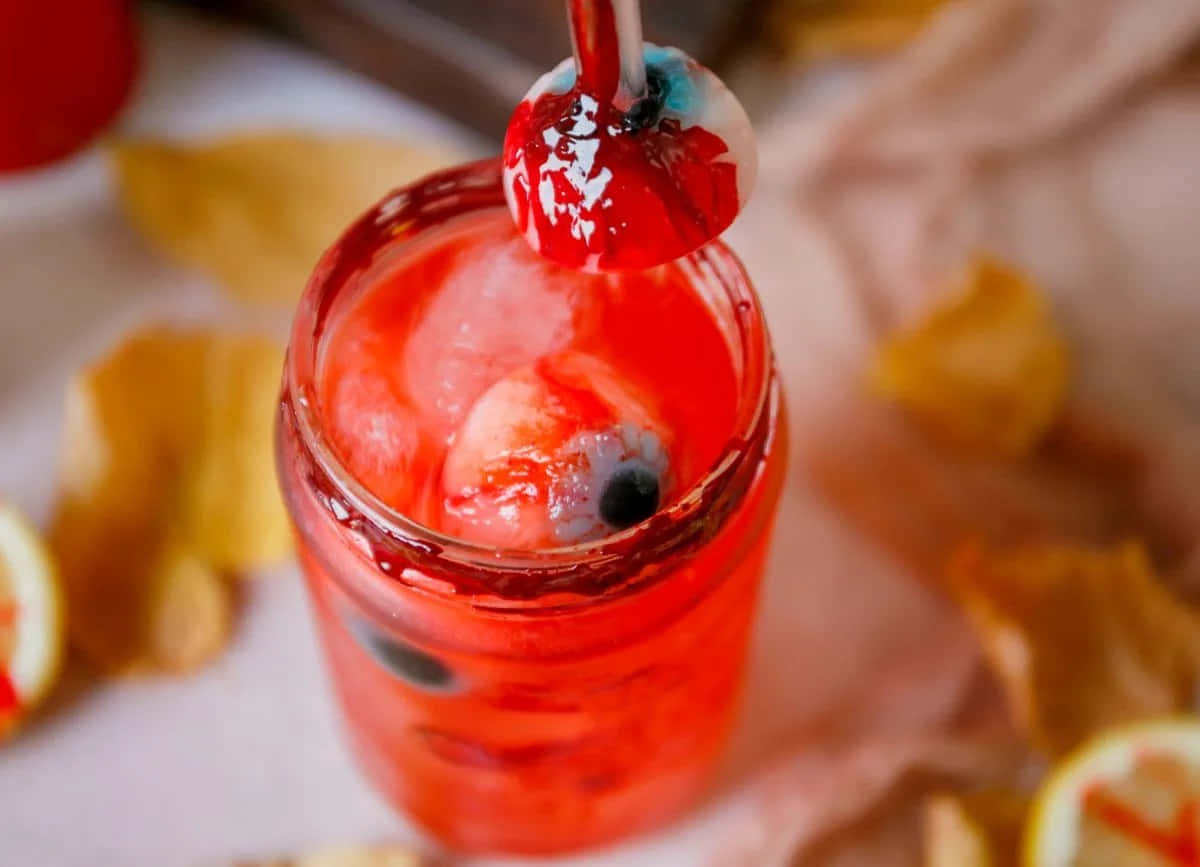 Halloween Drinks, vivid red cocktail, gummy eyeball garnish, SD Desktop Wallpaper