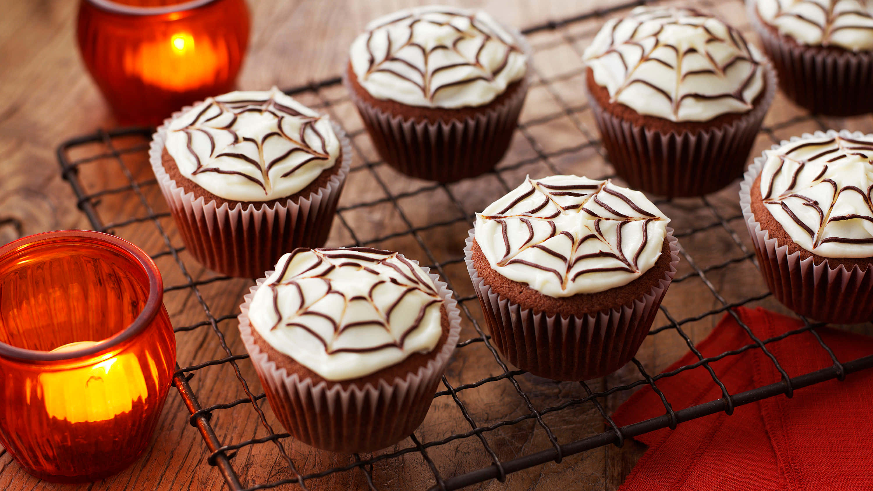 Halloween Cupcakes, spiderweb frosted, glowing orange candles, 2K Desktop Wallpaper