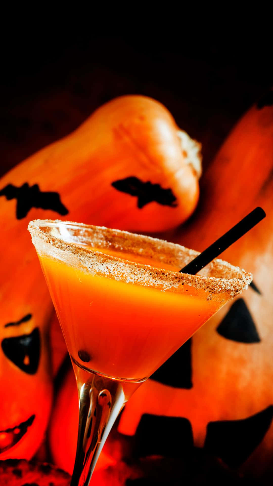 glowing orange Halloween cocktail, sugar-rimmed martini glass, carved pumpkins, Full HD Phone Wallpaper