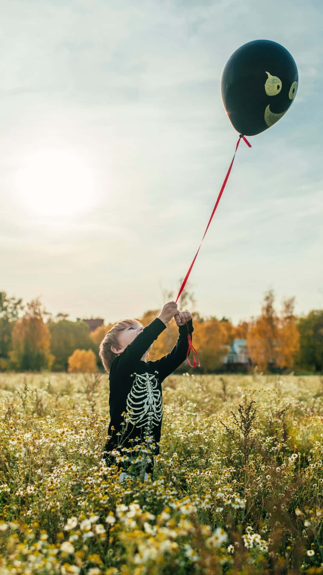 skeleton costume, child, sunlit field of wildflowers, Full HD Phone Wallpaper
