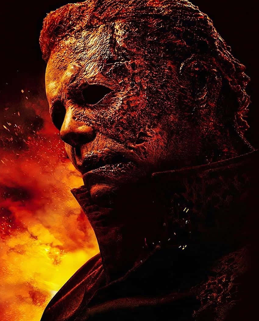 Halloween Michael Myers, burned face, fiery orange and red explosion, SD Phone Wallpaper