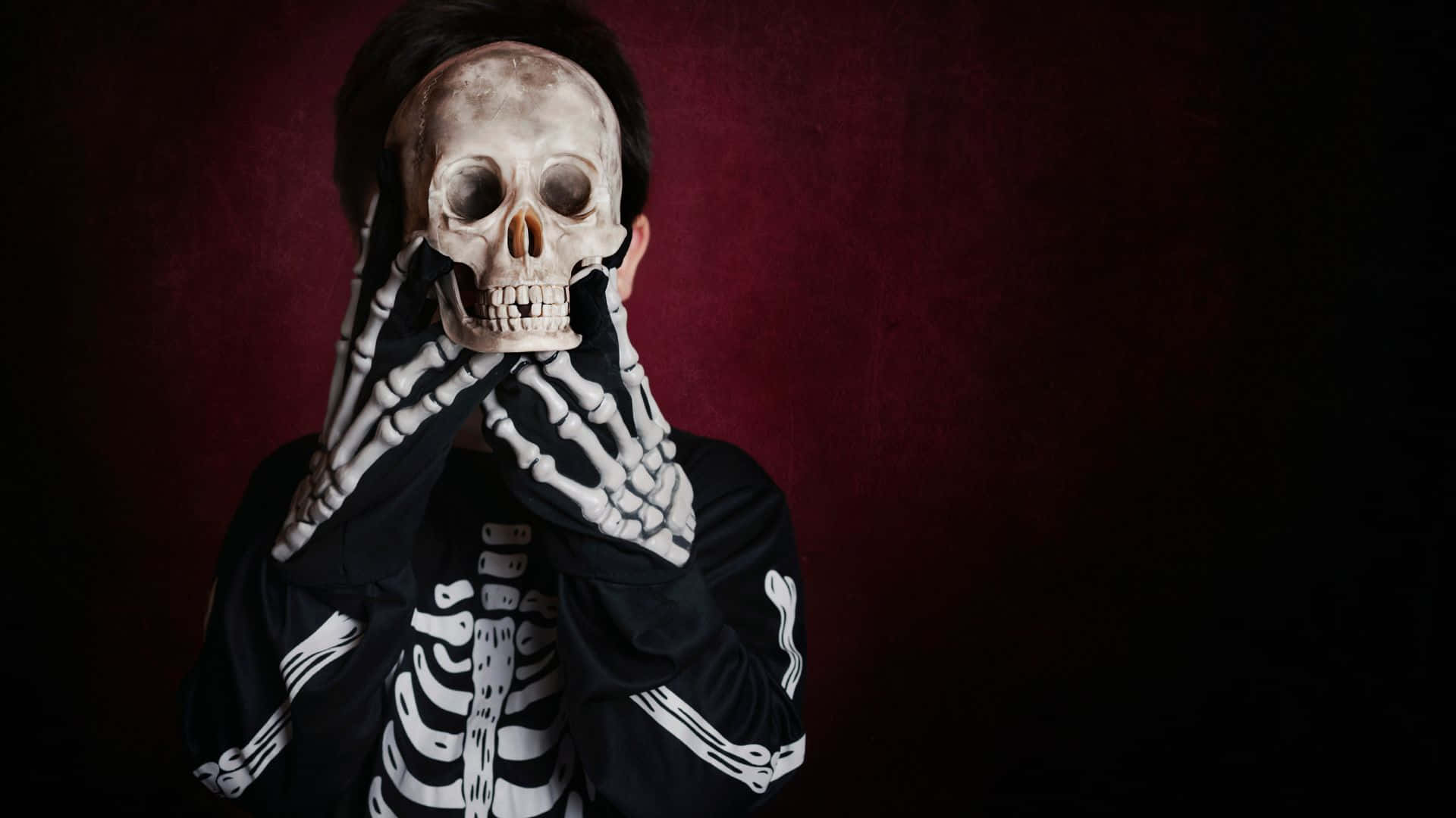 skeleton costume, skull mask, deep red backdrop, Full HD Desktop Wallpaper