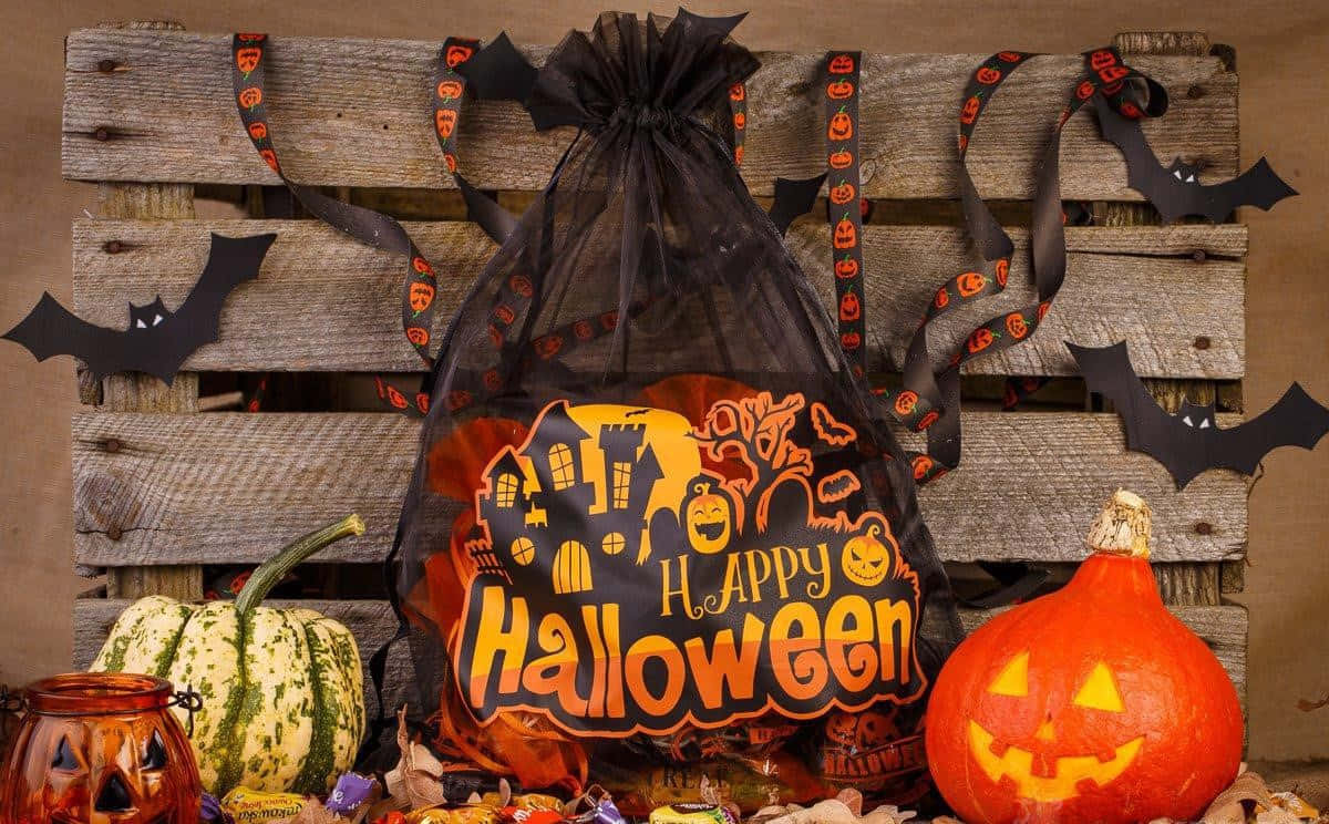Trick or Treat Bag, black candy bag, carved pumpkins, SD Desktop Wallpaper