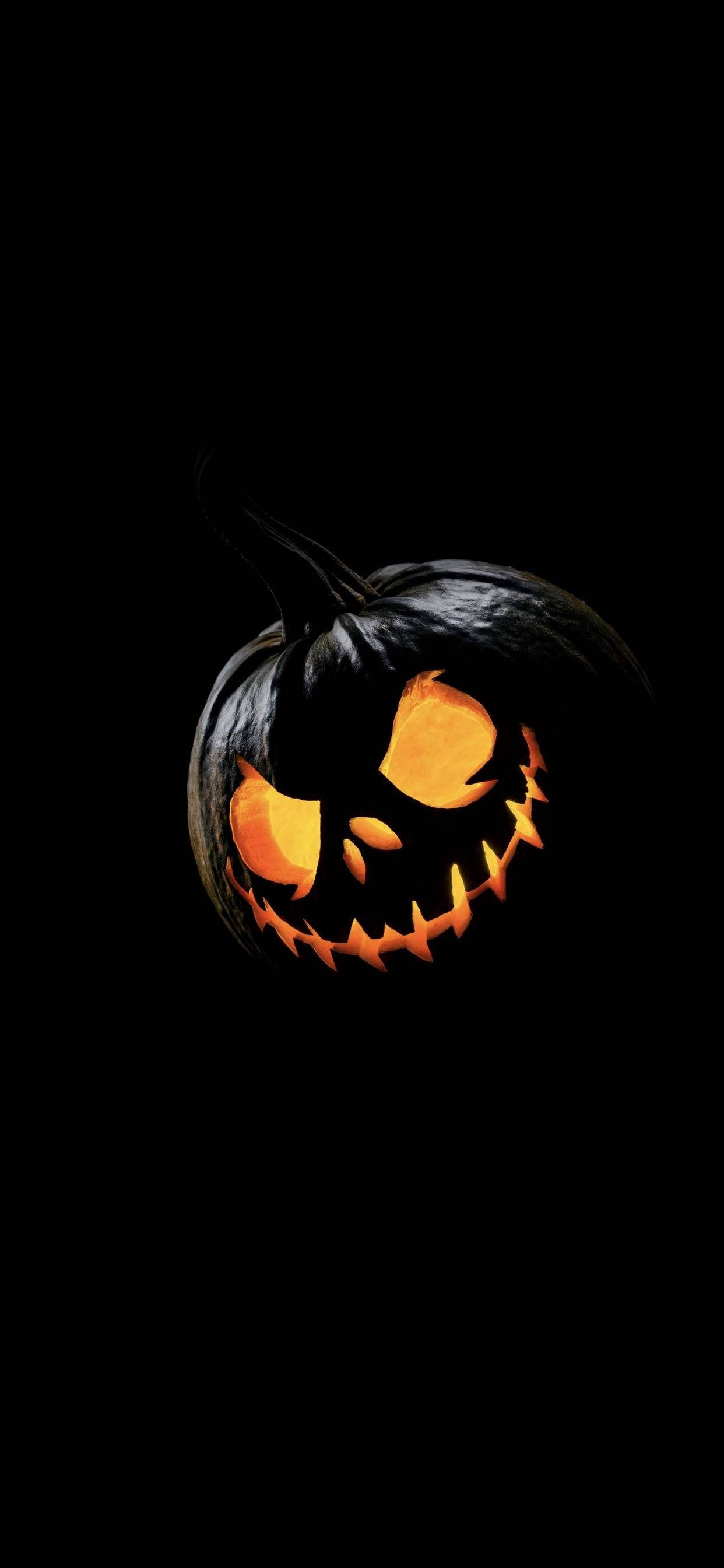 jack-o'-lantern, glowing, jagged grin, 2K Phone Wallpaper
