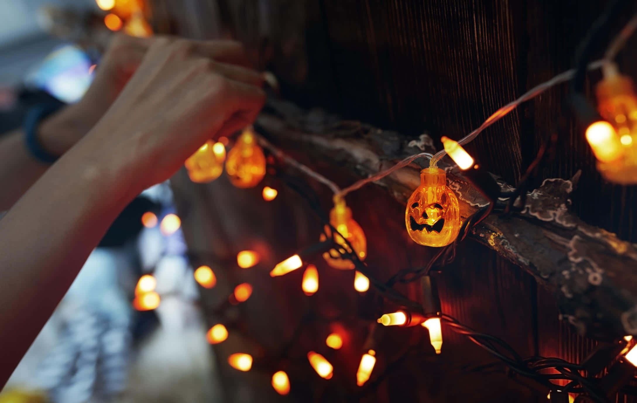 jack-o'-lantern string lights, rustic wooden beam, warm amber tones, Full HD Desktop Wallpaper