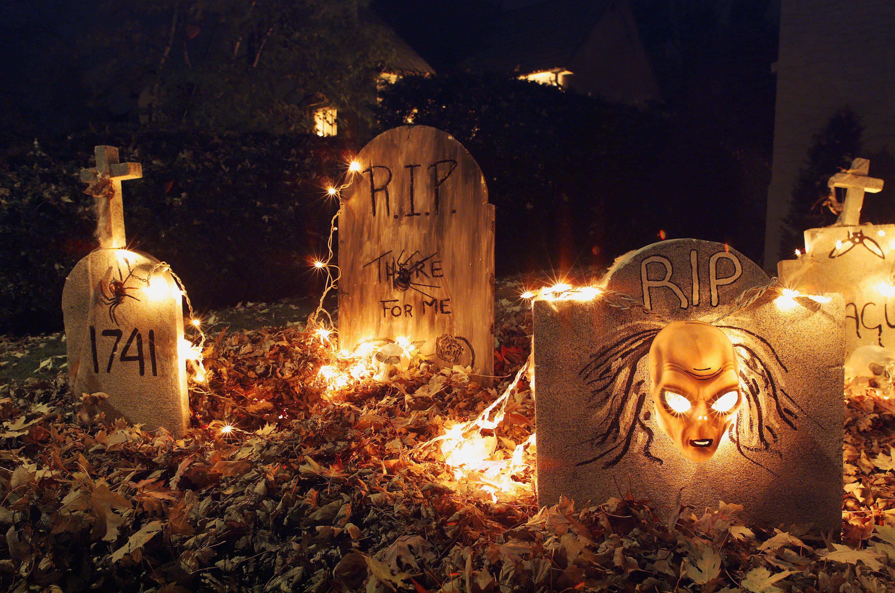 Halloween Yard Decorations, glowing string lights, spooky Halloween tombstones, 2K Desktop Wallpaper