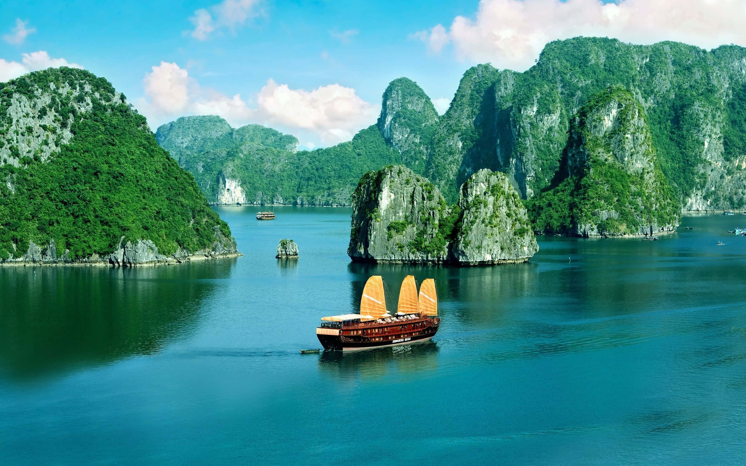 Halong Bay, traditional wooden junk boat, golden sails, 2K Desktop Wallpaper
