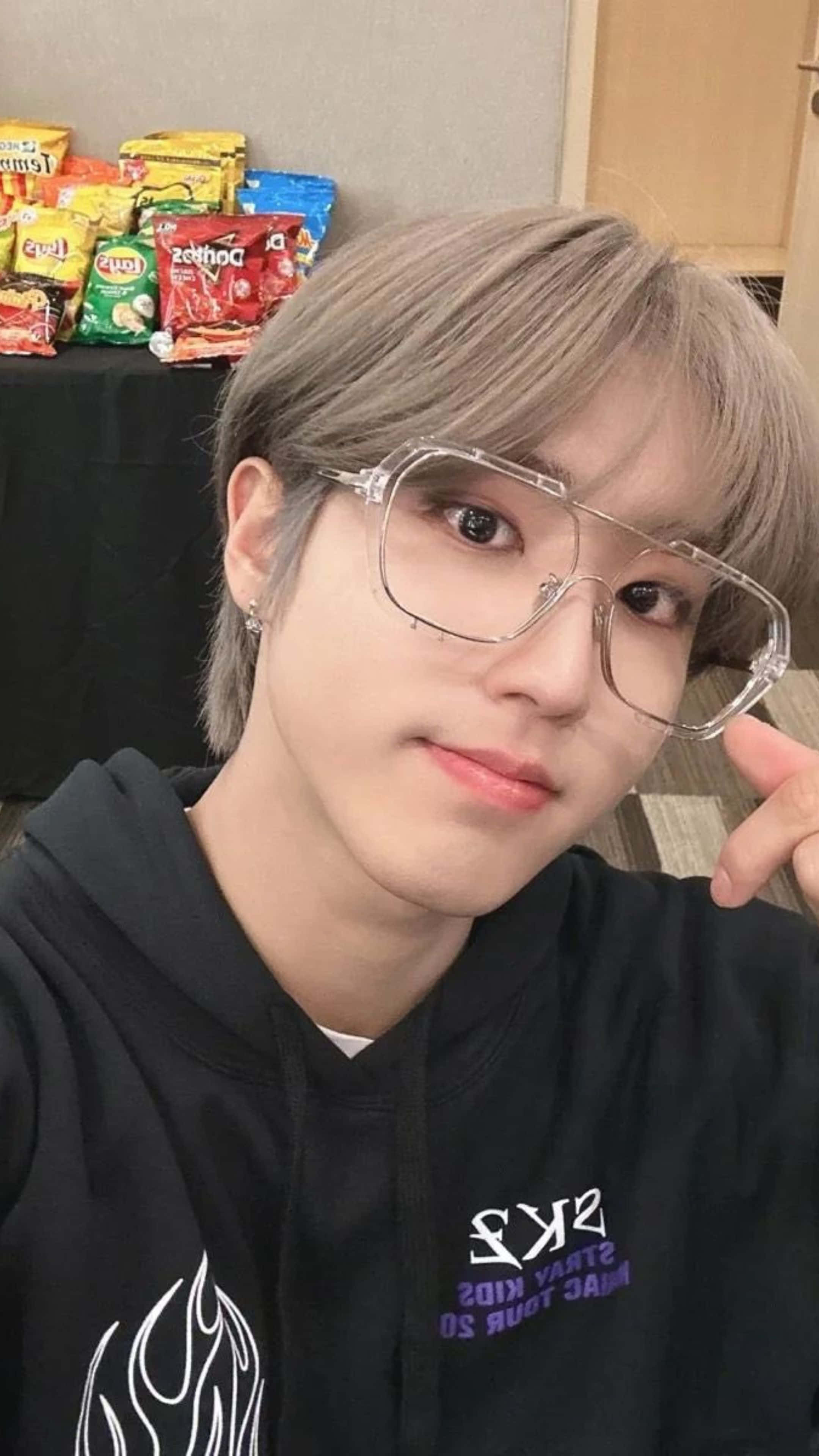 Han Jisung, light brown hair, clear-framed glasses, 4K Phone Wallpaper