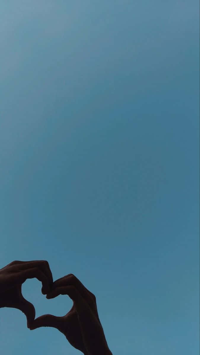 blue sky, heart shape, silhouetted hands, SD Phone Wallpaper