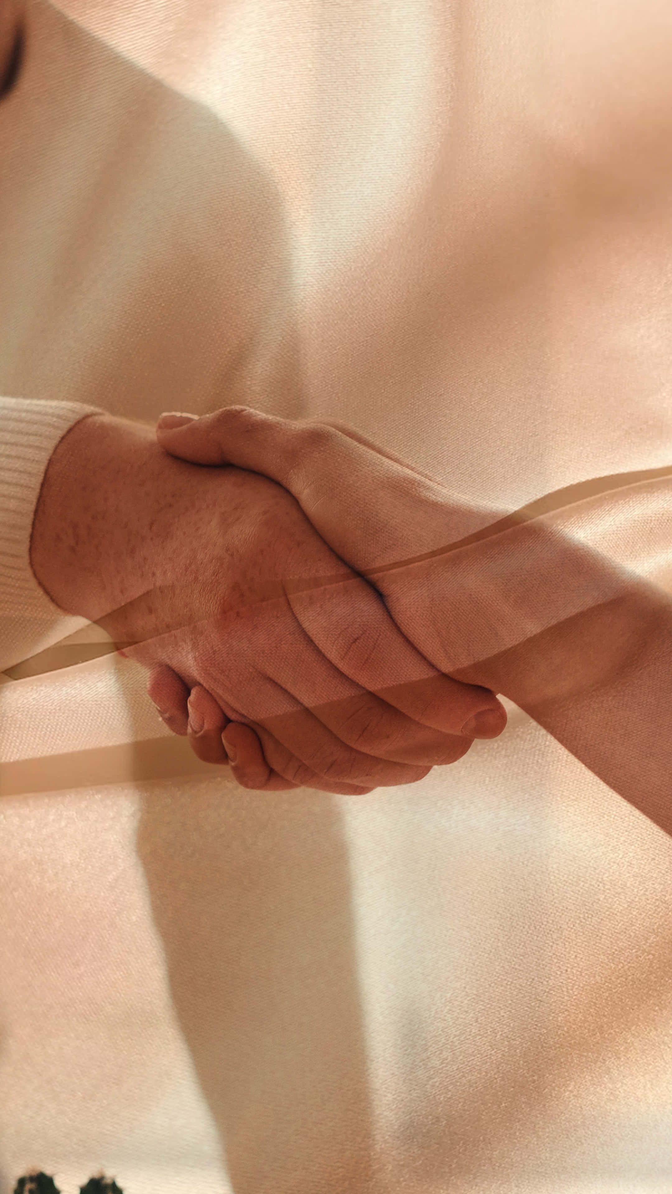 Warm Handshake, golden light, translucent fabric, 4K Phone Wallpaper