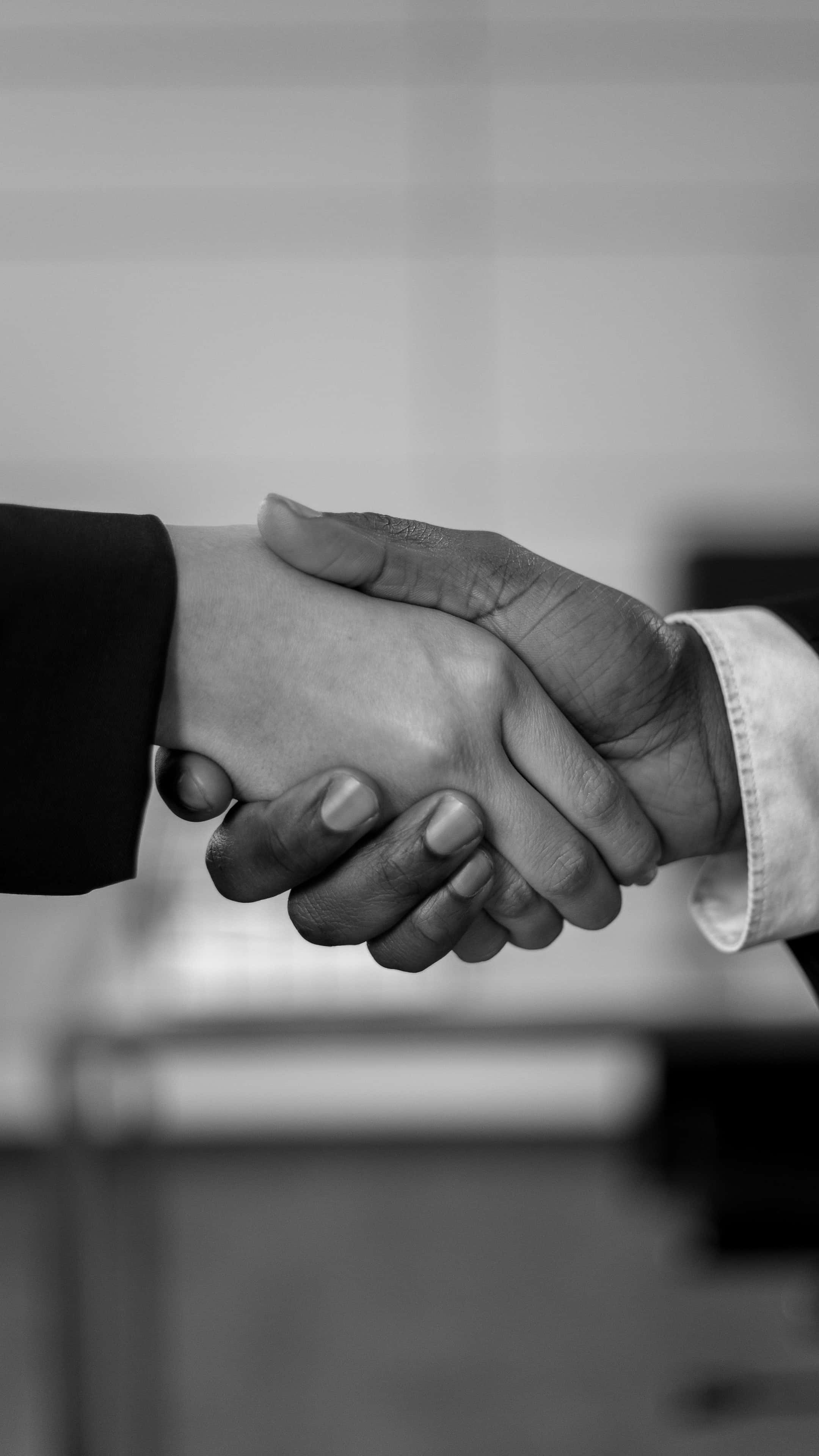 black and white, firm handshake, close-up, 4K Phone Wallpaper