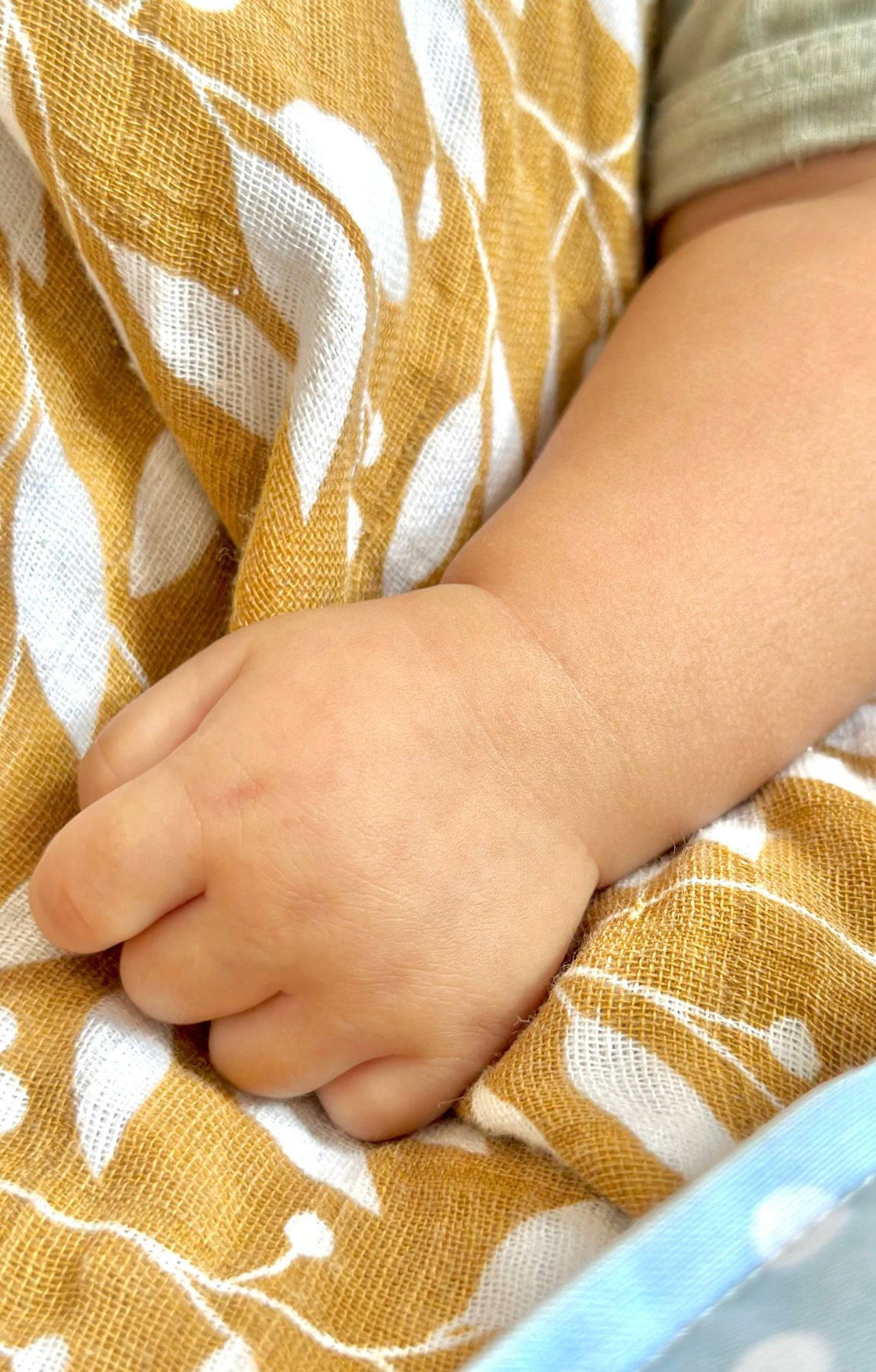 baby hand, mustard yellow, white leaf-patterned fabric, HD Phone Wallpaper