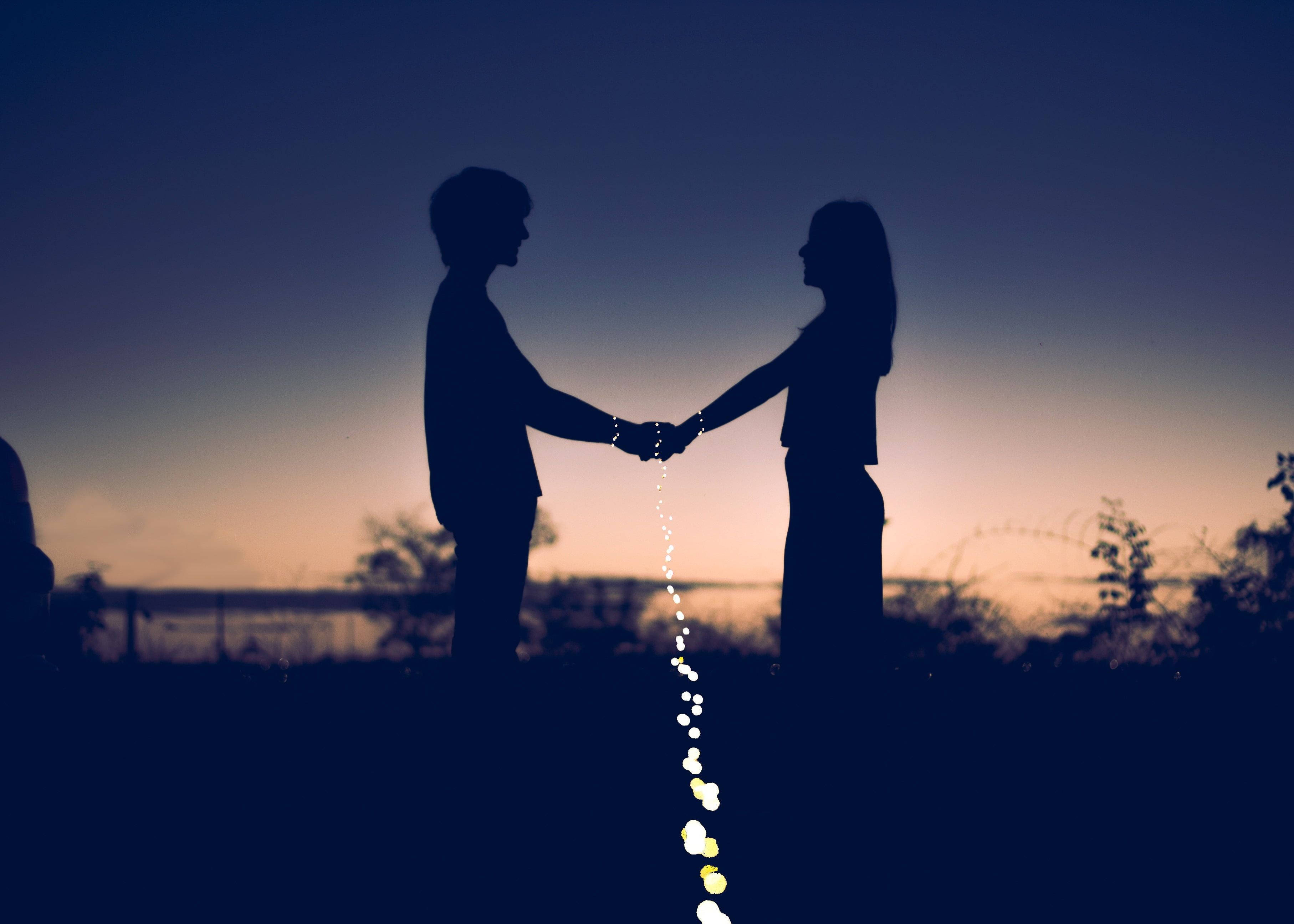twilight sky, glowing string lights, silhouetted couple, 2K Desktop Wallpaper