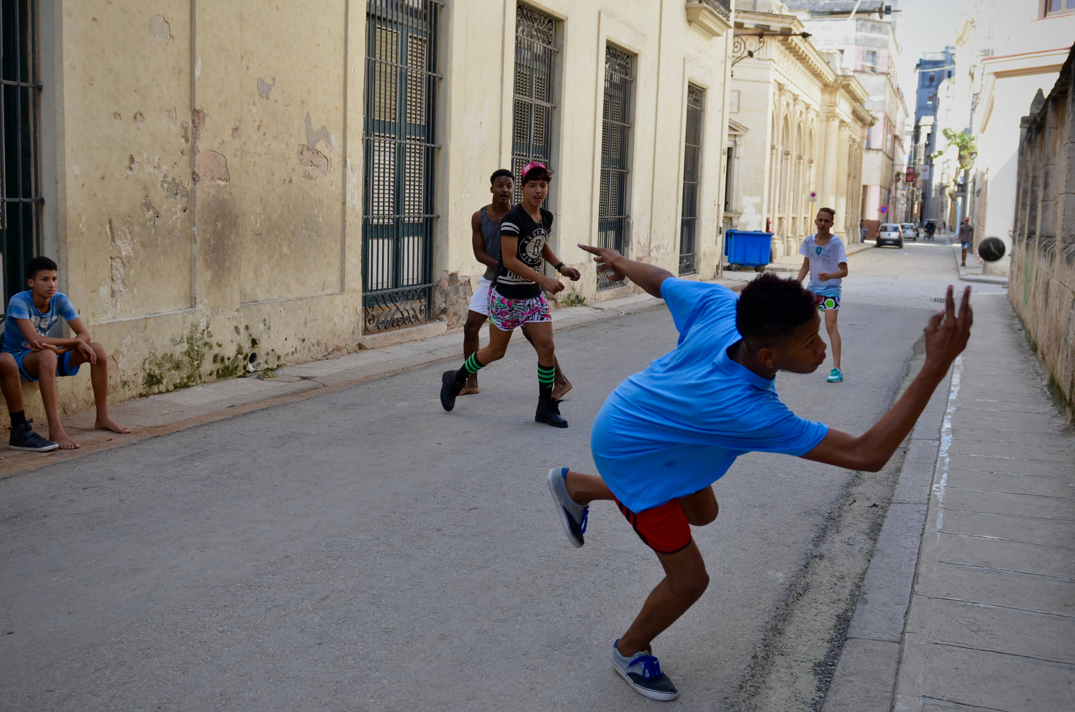 Handball, street game, sunlit urban alley, 2K Desktop Wallpaper