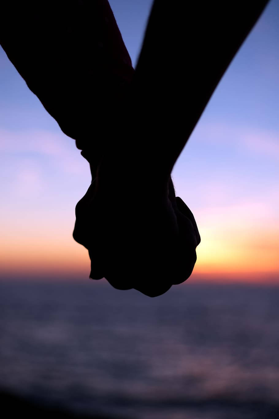 Hand In Hand Silhouette, vibrant sunset sky, calm ocean waters, HD Phone Wallpaper