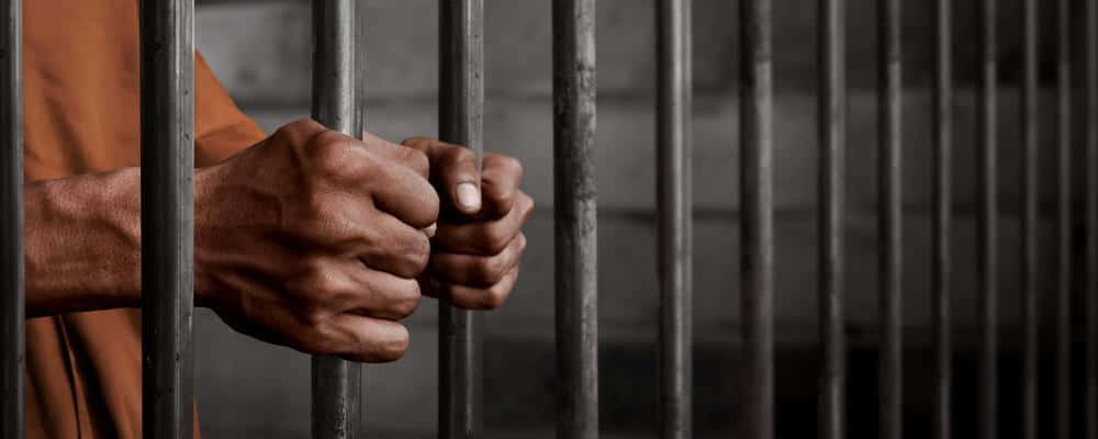 Aggravated Captive, prisoner's hands, prison bars, SD Desktop Wallpaper