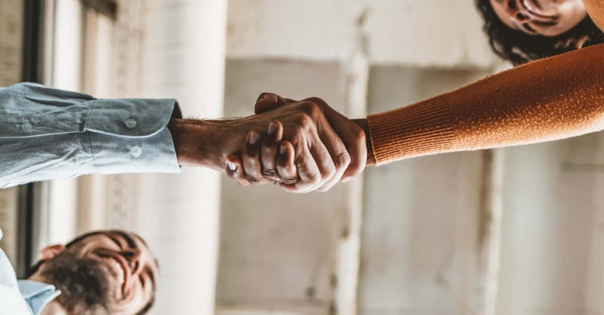 Handshake, Indoor setting, Soft natural light, SD Desktop Wallpaper