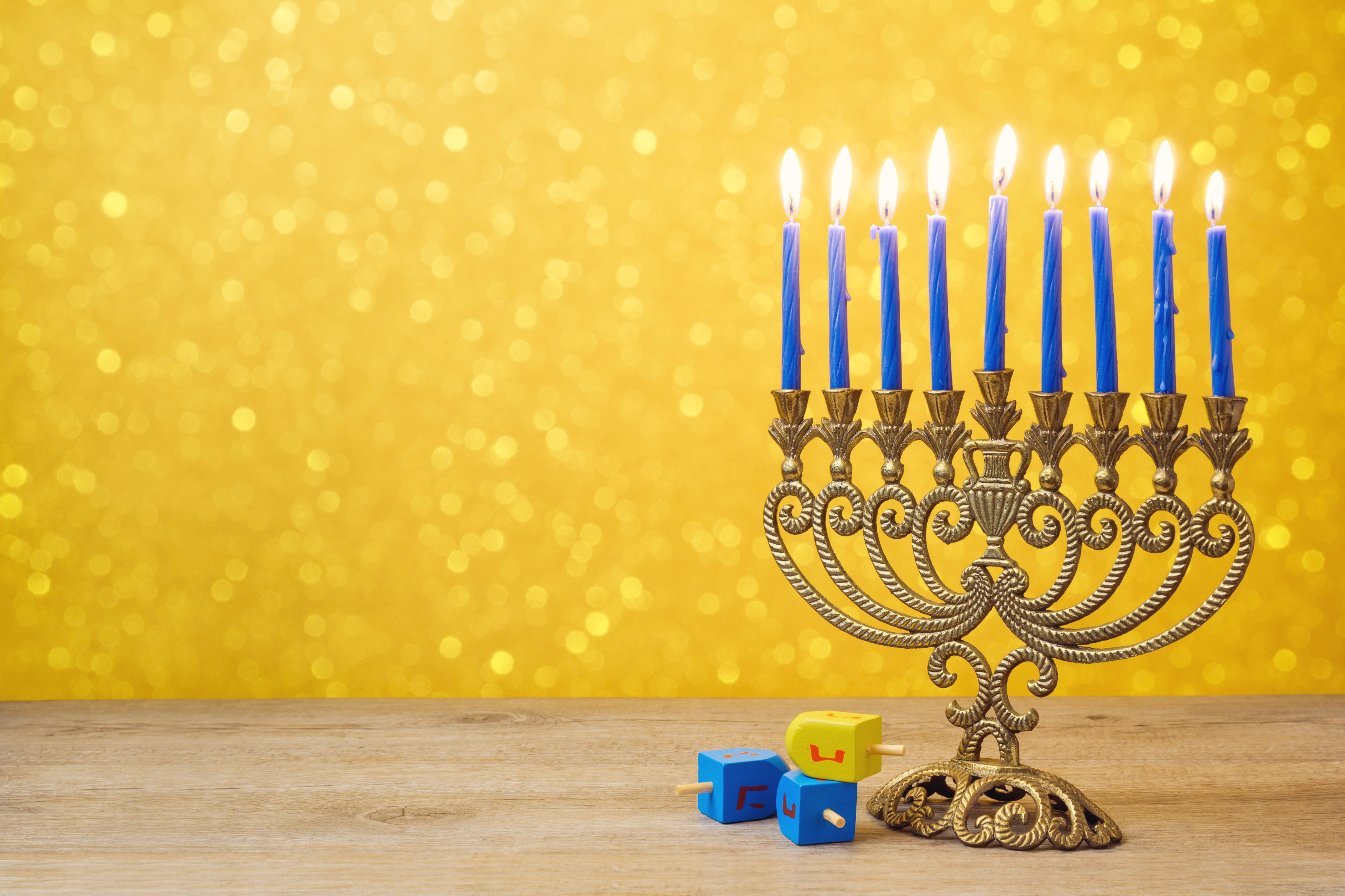 golden menorah, nine lit blue candles, wooden surface, 5K Desktop Wallpaper