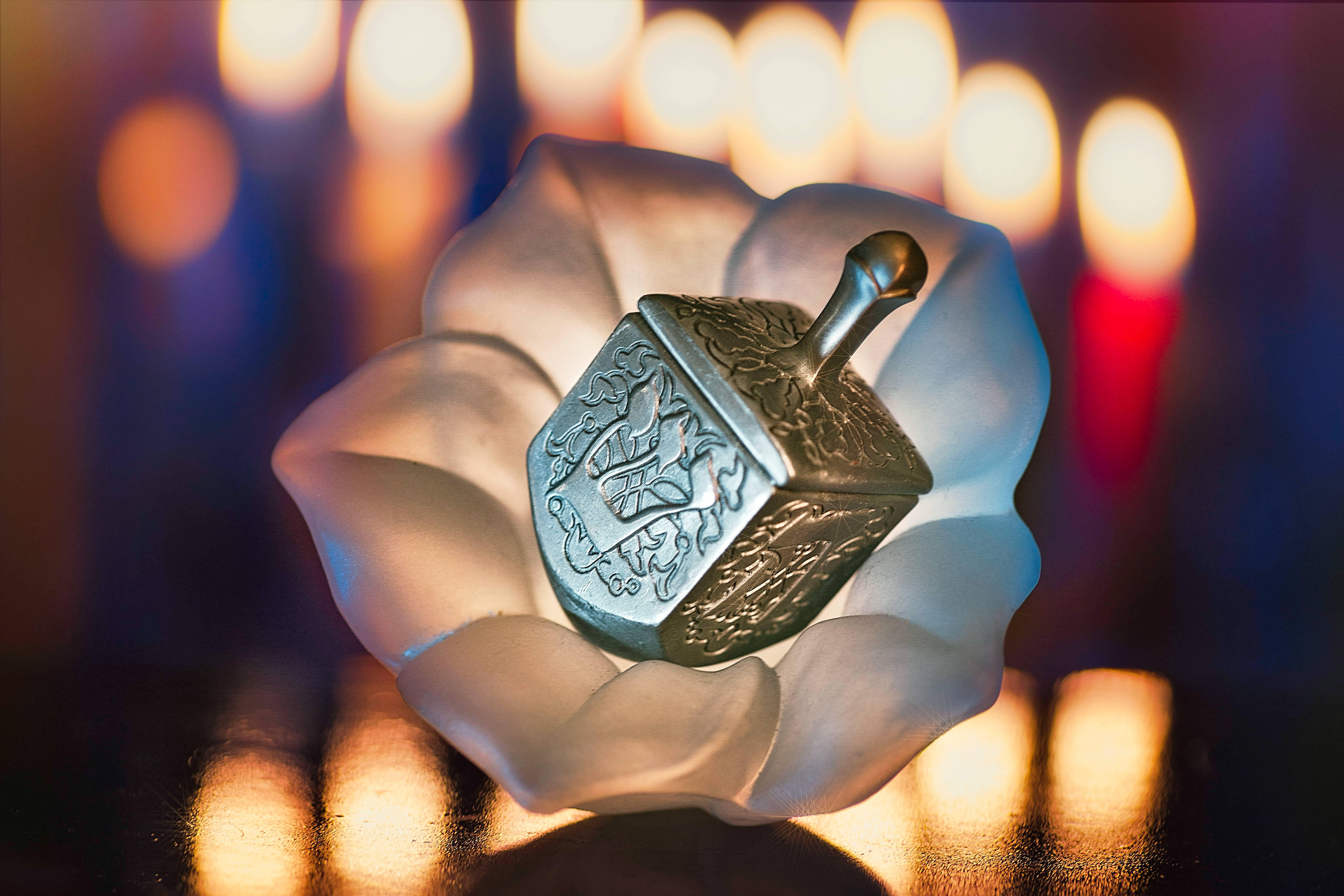 silver dreidel, Hebrew engravings, white ceramic bowl, 5K Desktop Wallpaper