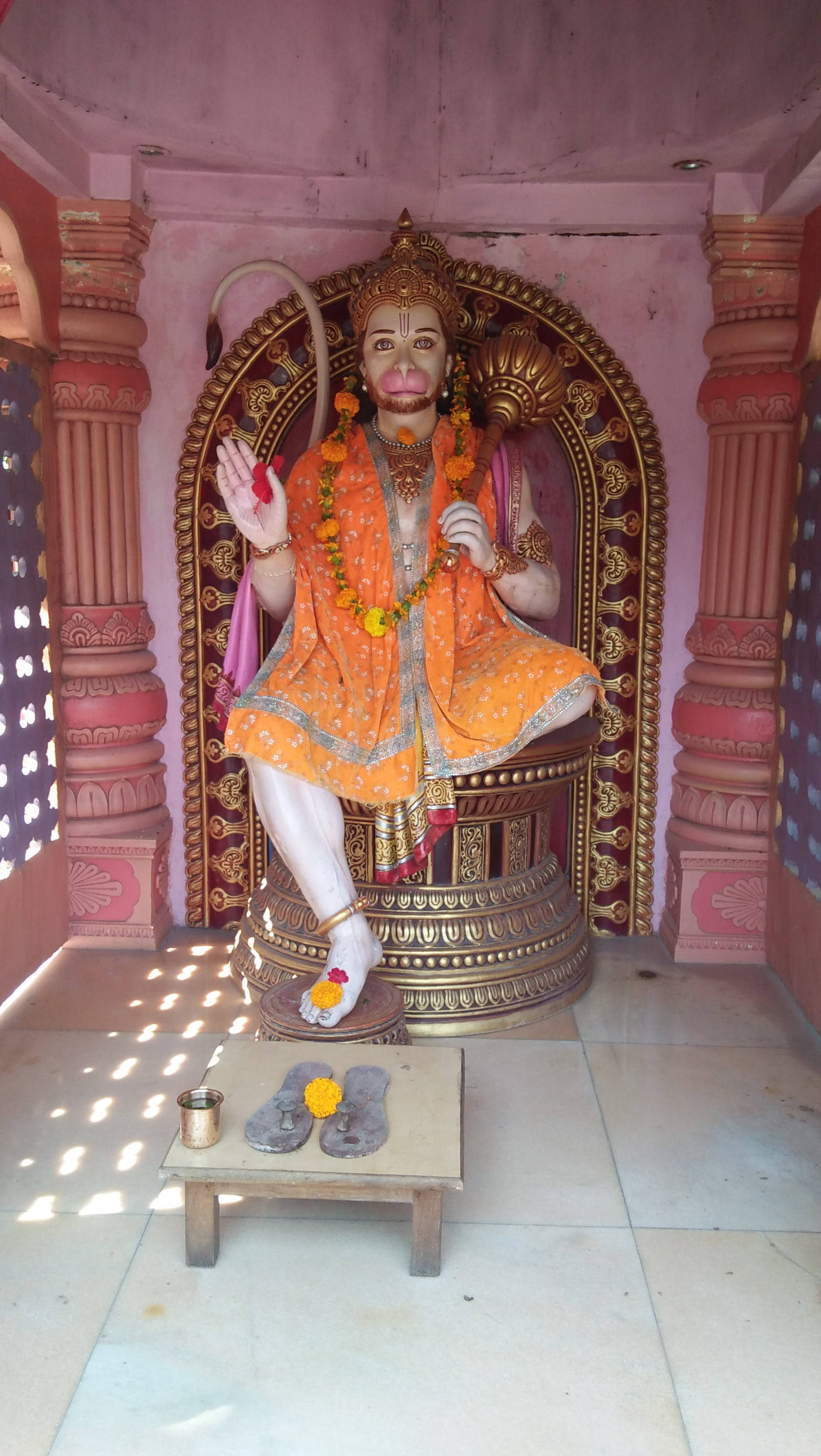 Hanuman, orange statue, pink temple niche, 2K Phone Wallpaper