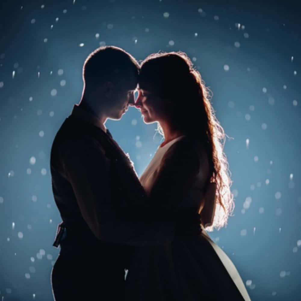 silhouetted couple, snowflakes, cool blue backdrop, SD Desktop Wallpaper
