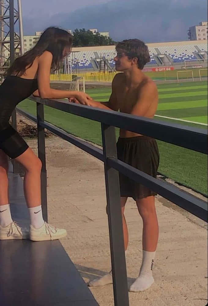 girlfriend and boyfriend, couple in love, stadium, SD Phone Wallpaper