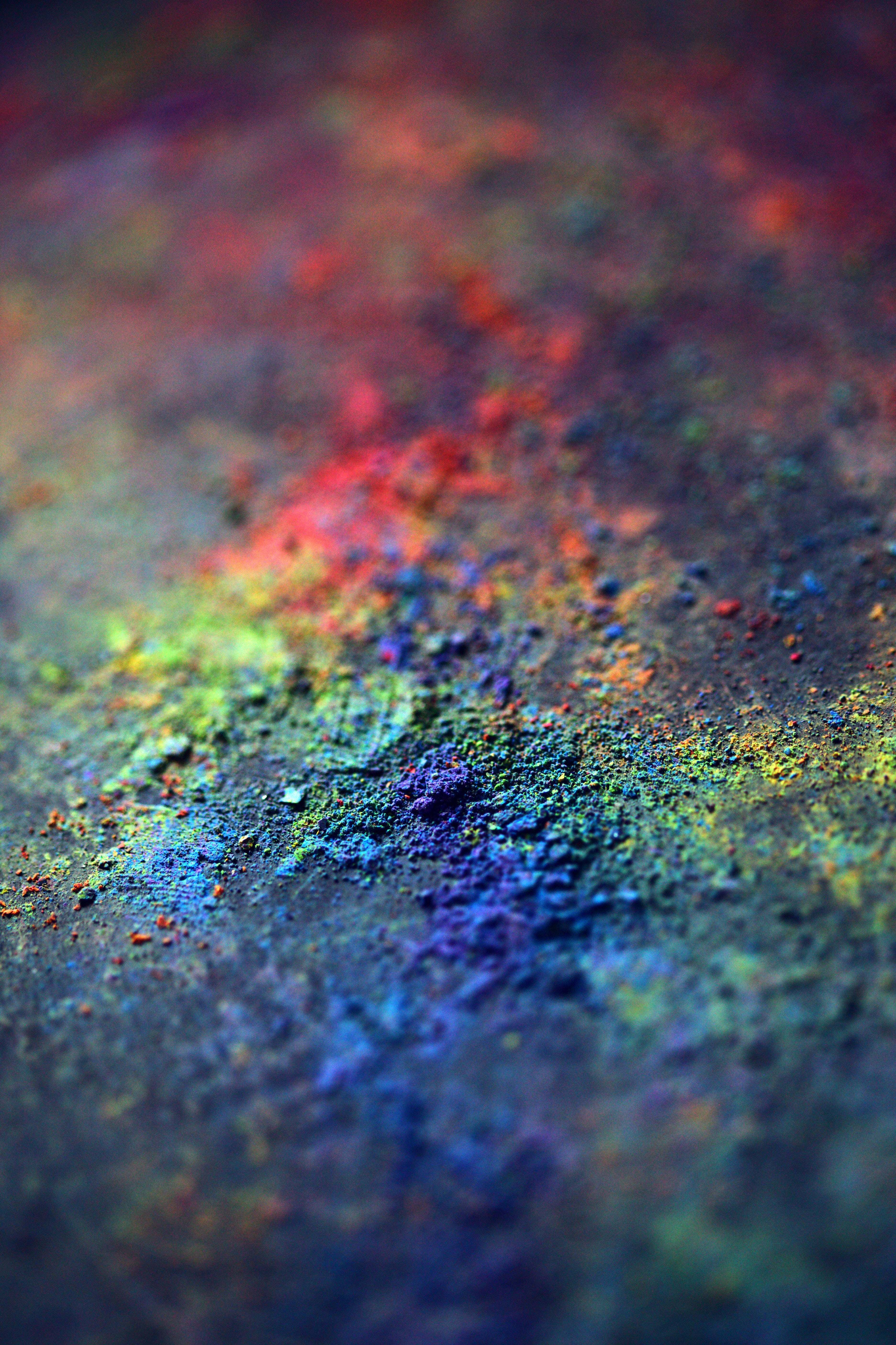 Happy Holi HD, rainbow-colored powder, dark textured surface, 5K Phone Wallpaper