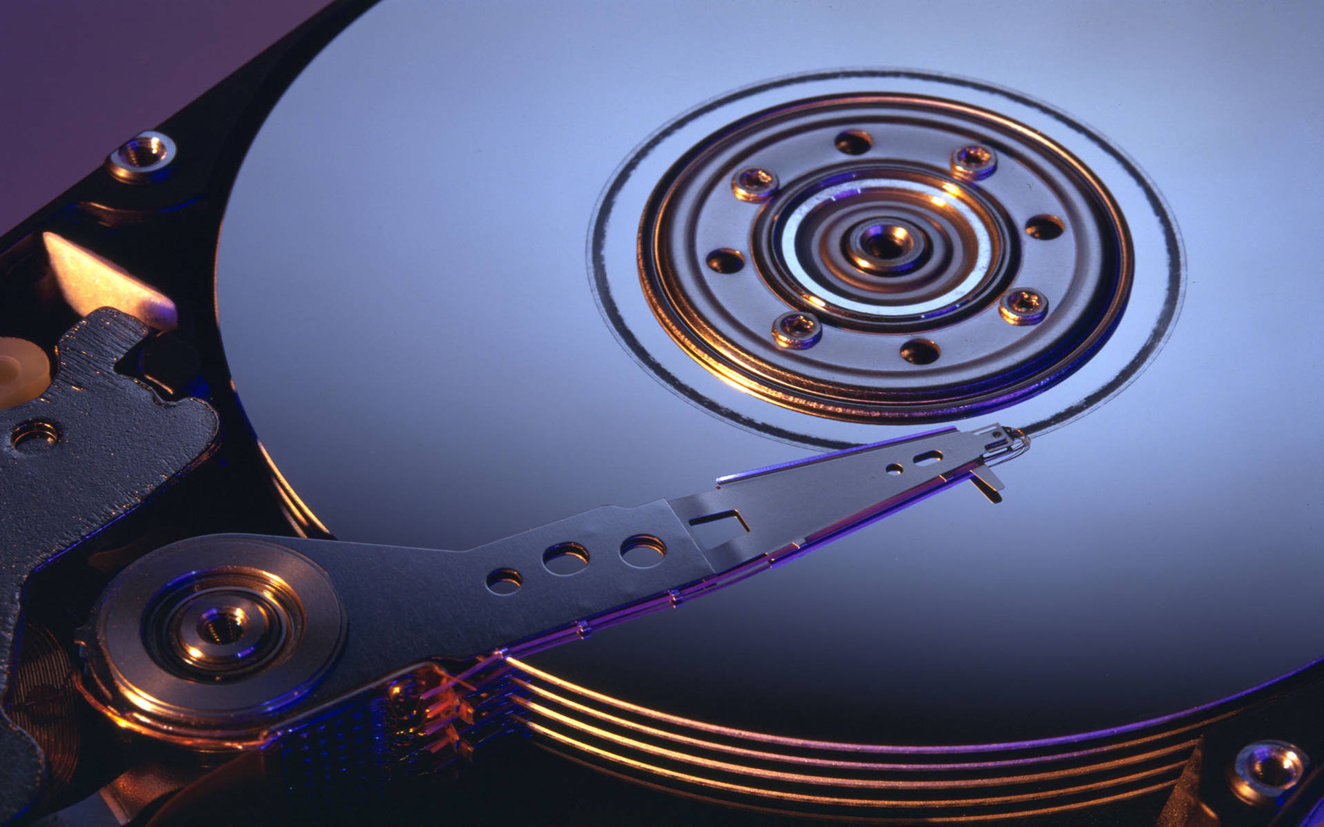 polished internal computer hard drive disk, spinning hard drive platter, glowing metallic read/write head, Full HD Desktop Wallpaper