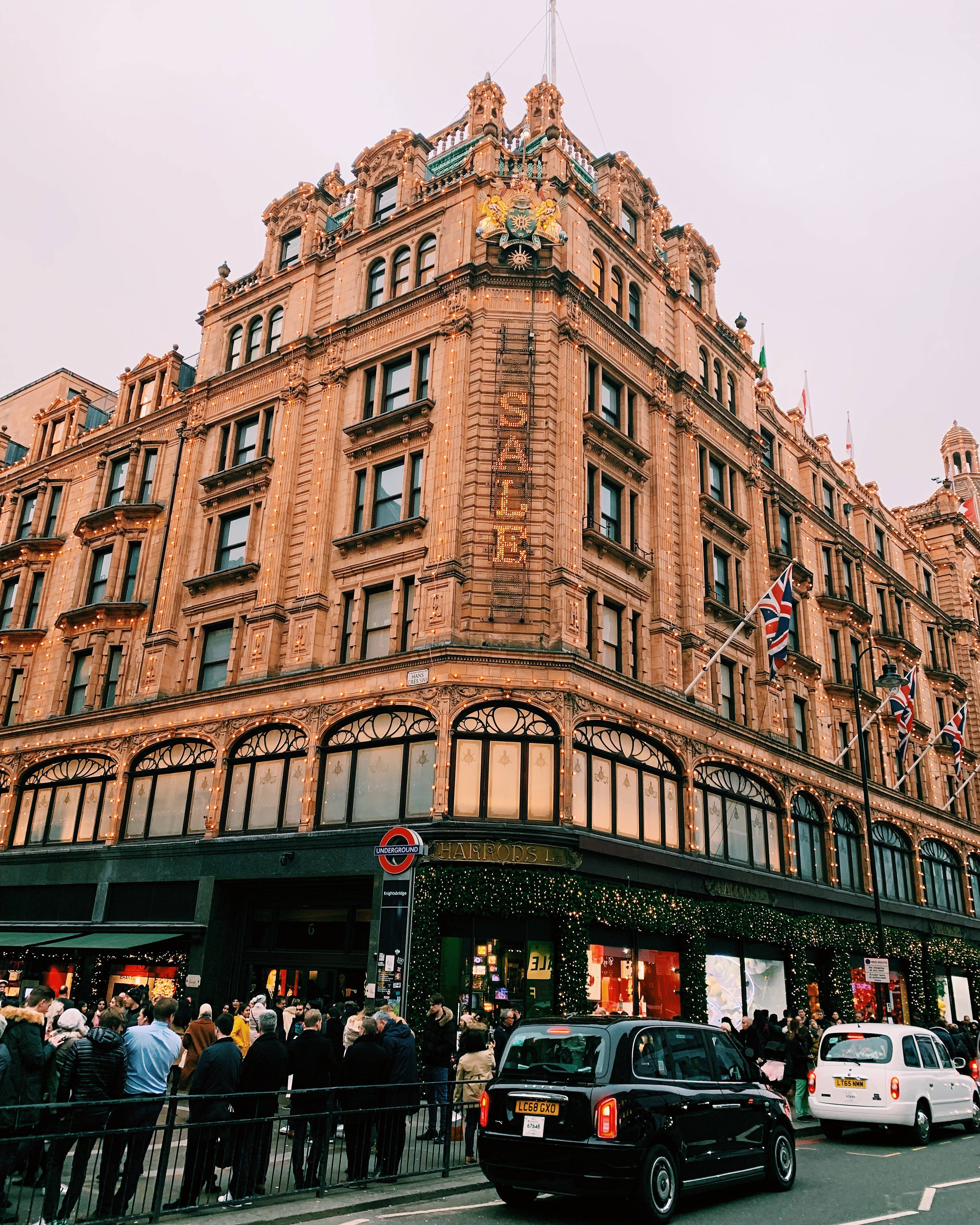 Harrods, brownstone building, SALE signage, 2K Phone Wallpaper