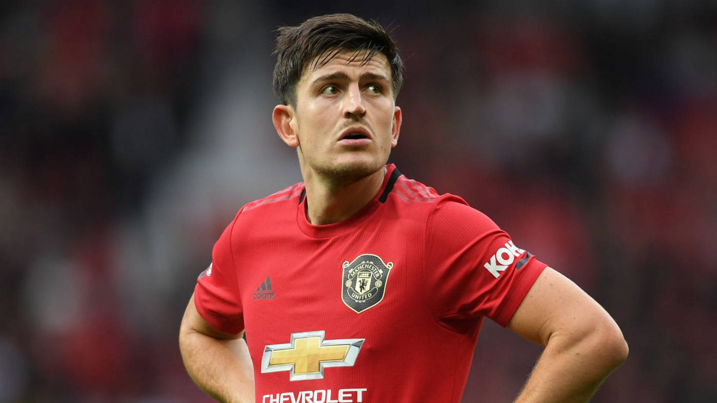 Harry Maguire, red Manchester United jersey, stadium crowd, HD Desktop Wallpaper