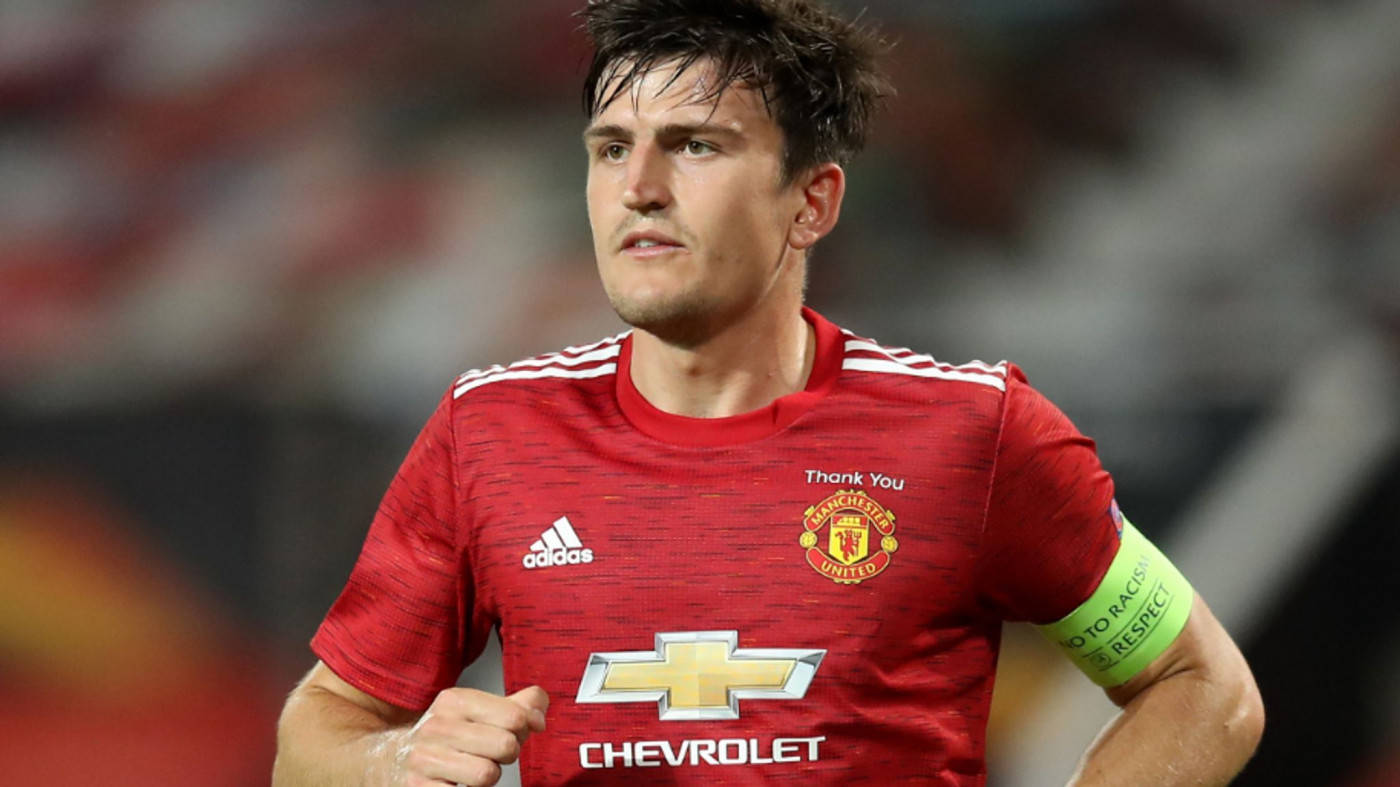 Harry Maguire, red Manchester United jersey, stadium pitch, HD Desktop Wallpaper