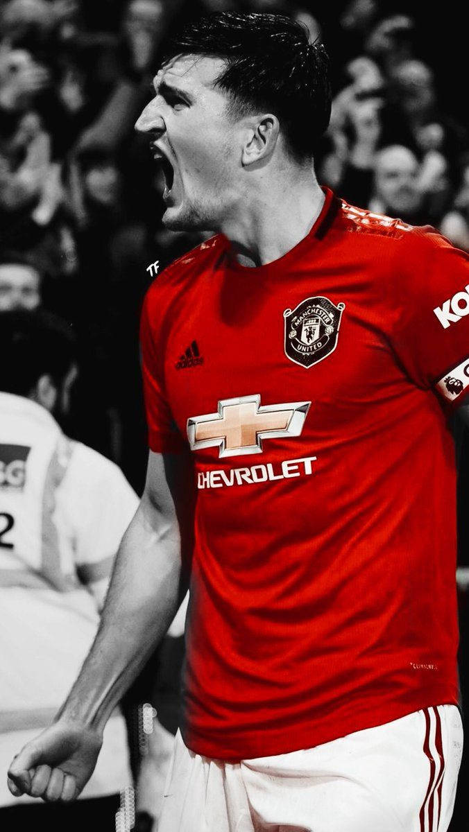 Harry Maguire, red Manchester United jersey, monochrome and red filter, SD Phone Wallpaper