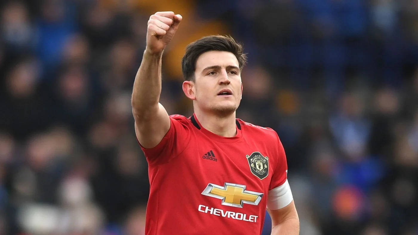 Harry Maguire, red Manchester United jersey, crowded stadium pitch, HD Desktop Wallpaper
