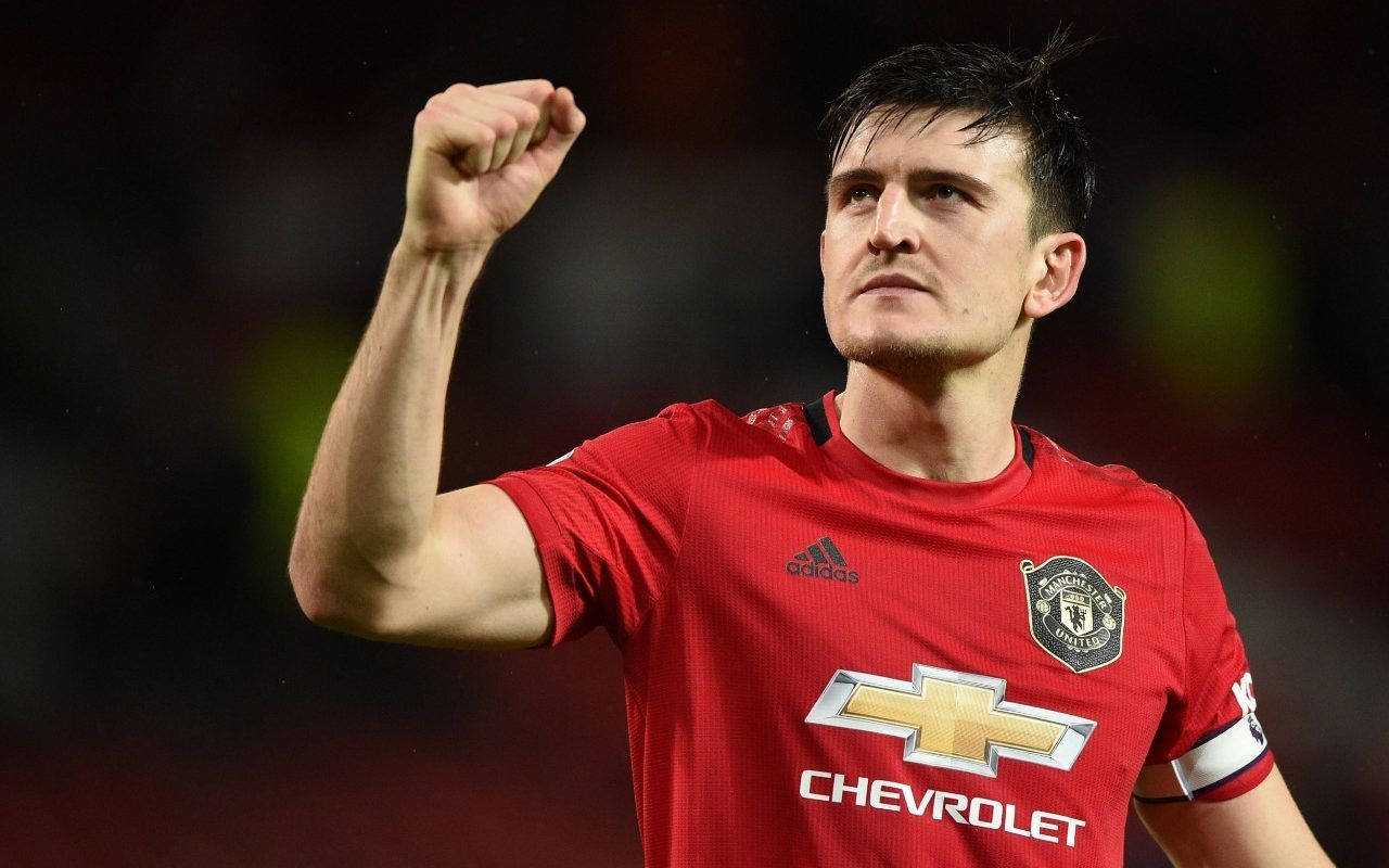 Harry Maguire, red Manchester United jersey, stadium lights, HD Desktop Wallpaper