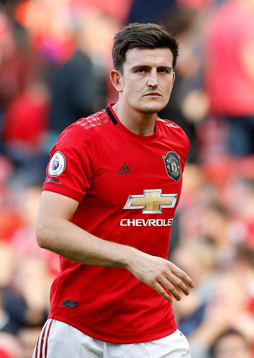 Harry Maguire, red Manchester United jersey, sunlit pitch, HD Phone Wallpaper