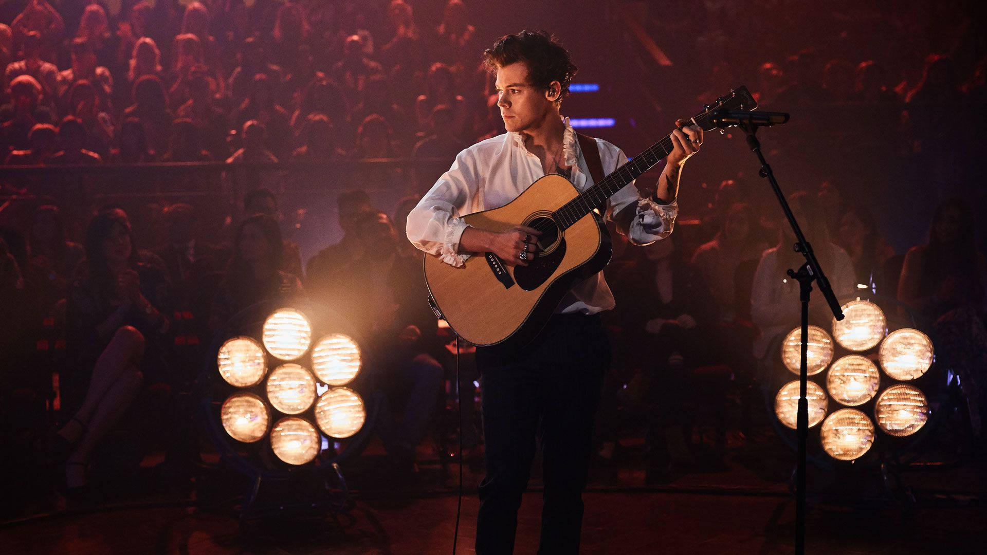 Harry Styles, acoustic guitar, warm stage lights, Full HD Desktop Wallpaper