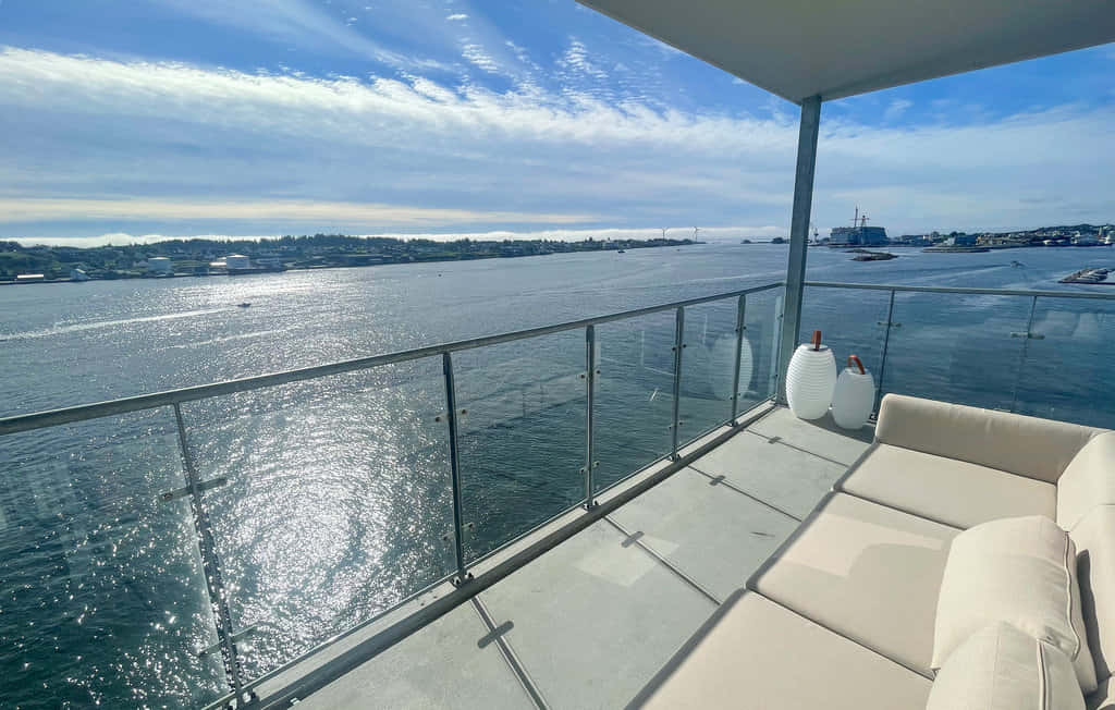 Haugesund, waterfront balcony view, beige lounge furniture, SD Desktop Wallpaper
