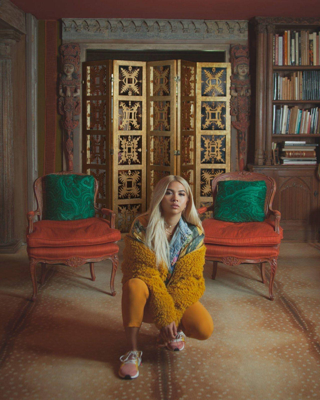 Hayley Kiyoko, fuzzy yellow jacket, richly decorated room, HD Phone Wallpaper