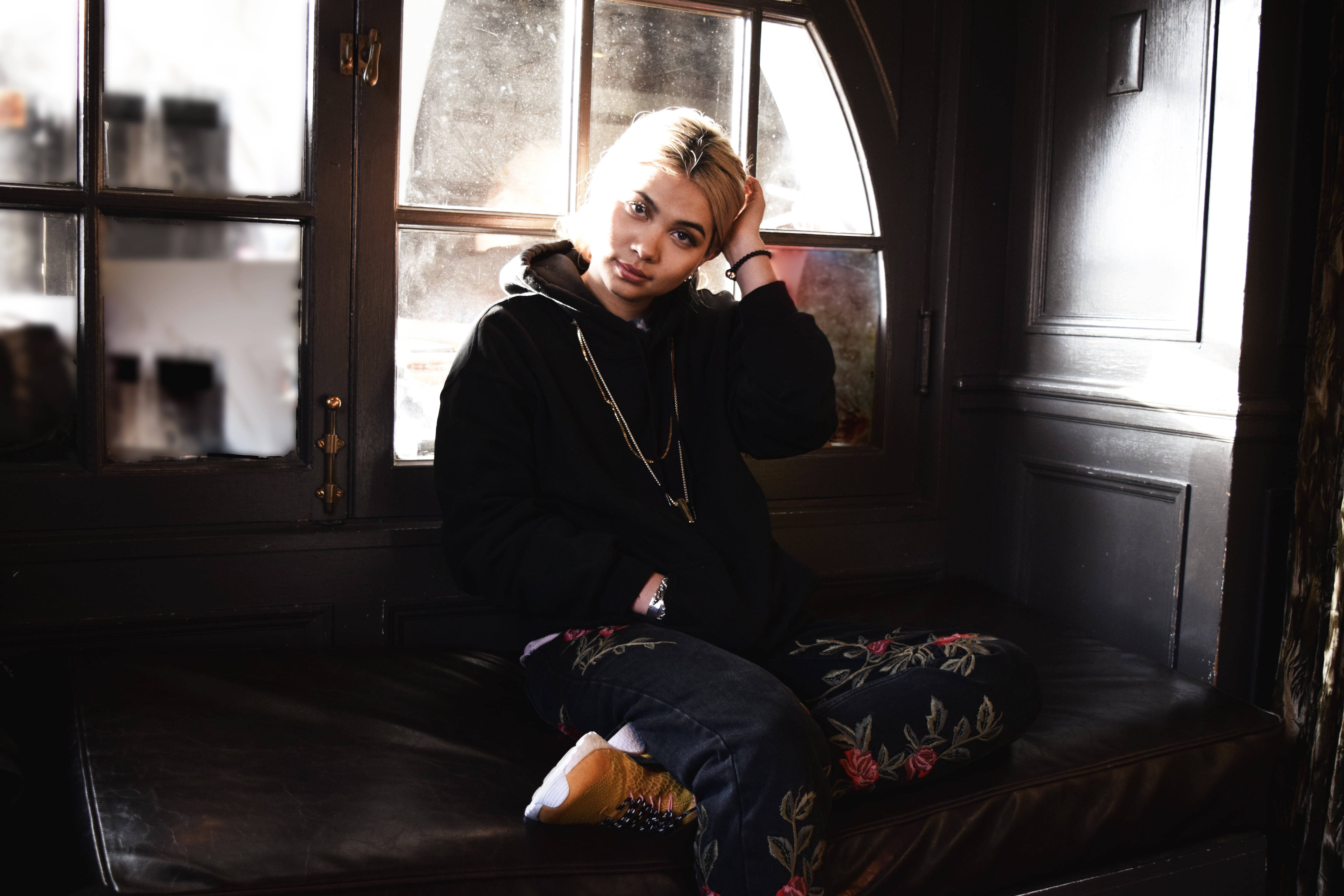 Hayley Kiyoko, blonde hair, leather bench, 5K Desktop Wallpaper