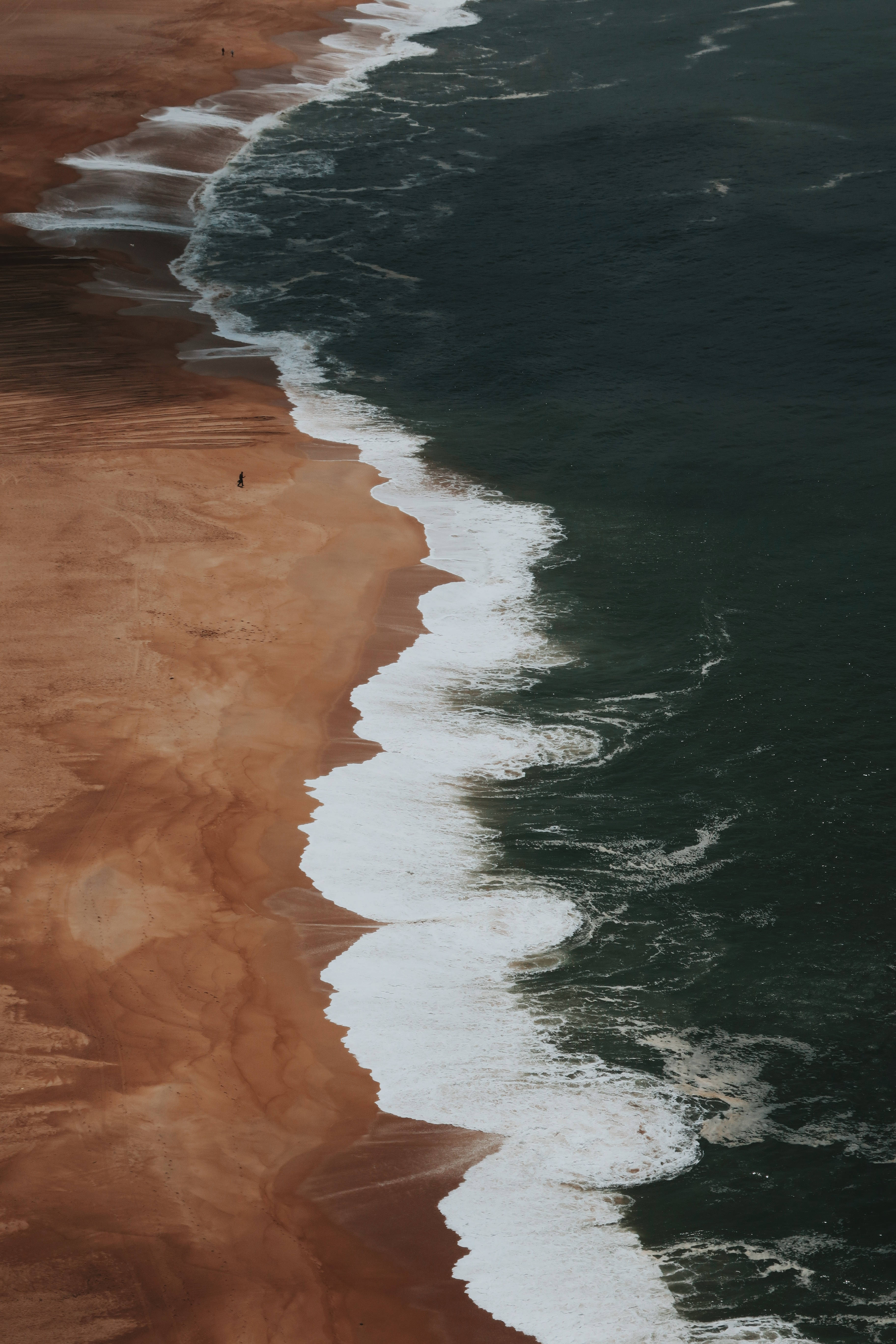 large beach aerial view, curved shoreline, dark ocean waves, 5K Phone Wallpaper
