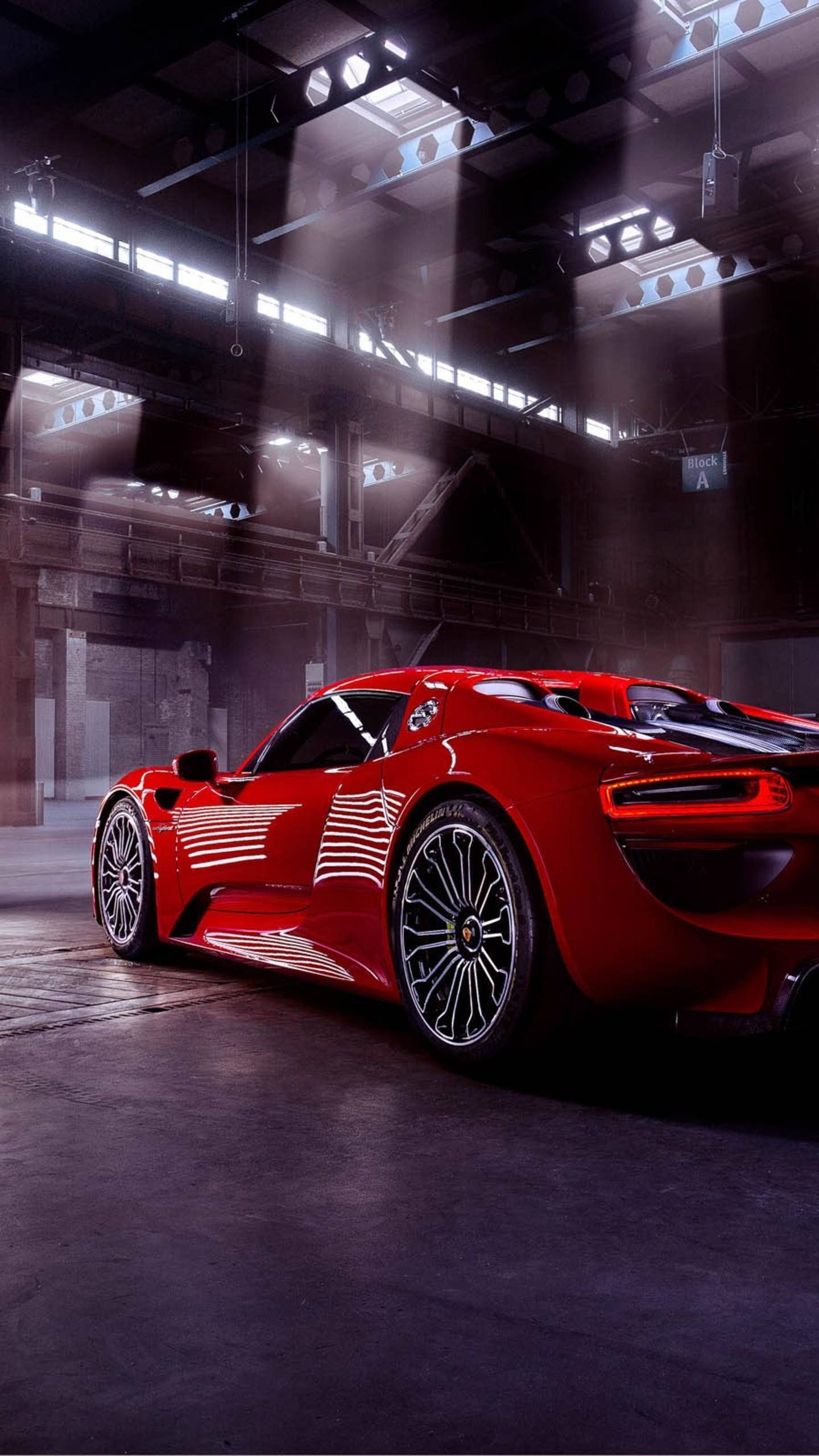 red sports car, spotlight, industrial warehouse, 2K Phone Wallpaper