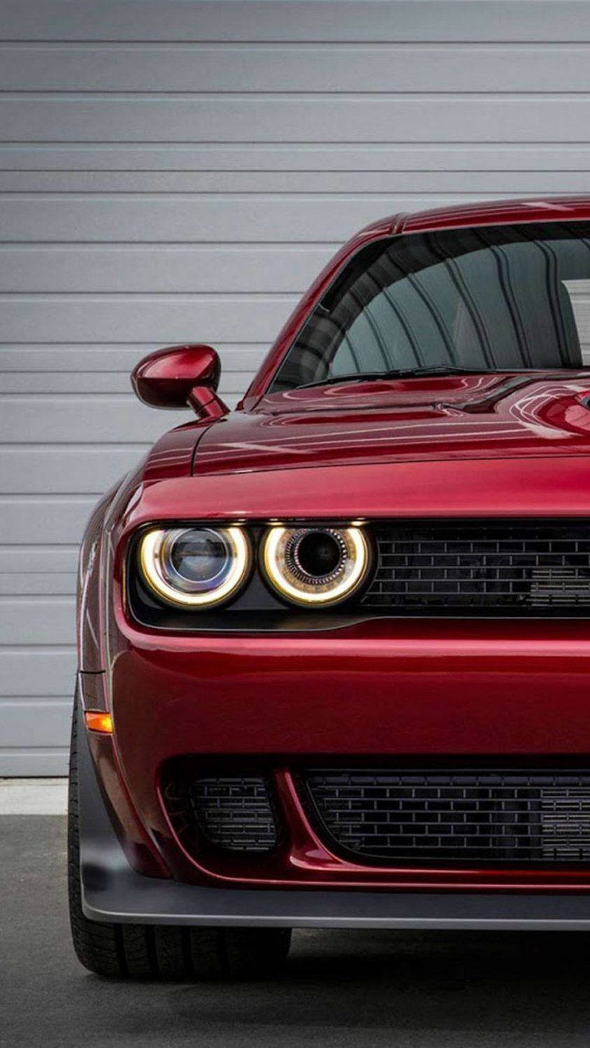 glossy red muscle car, glowing halo headlights, gray garage door, HD Phone Wallpaper