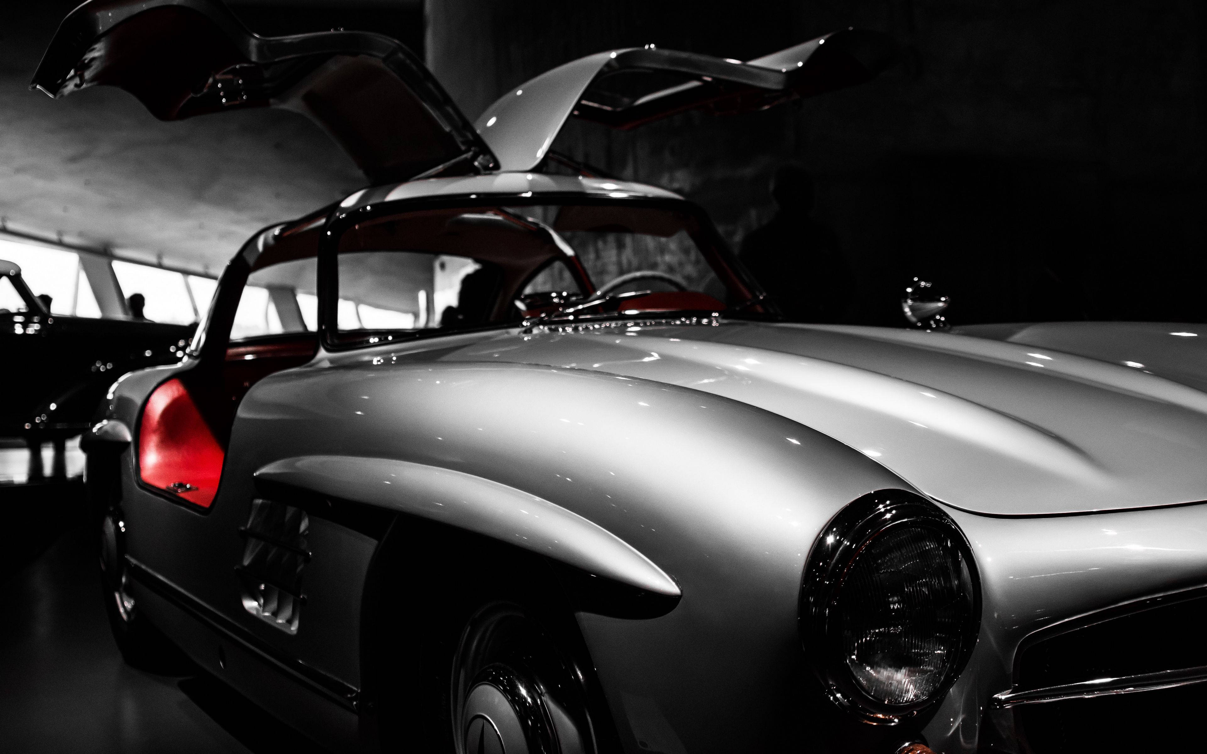 gull-wing doors, sleek silver classic car, museum setting, 4K Desktop Wallpaper