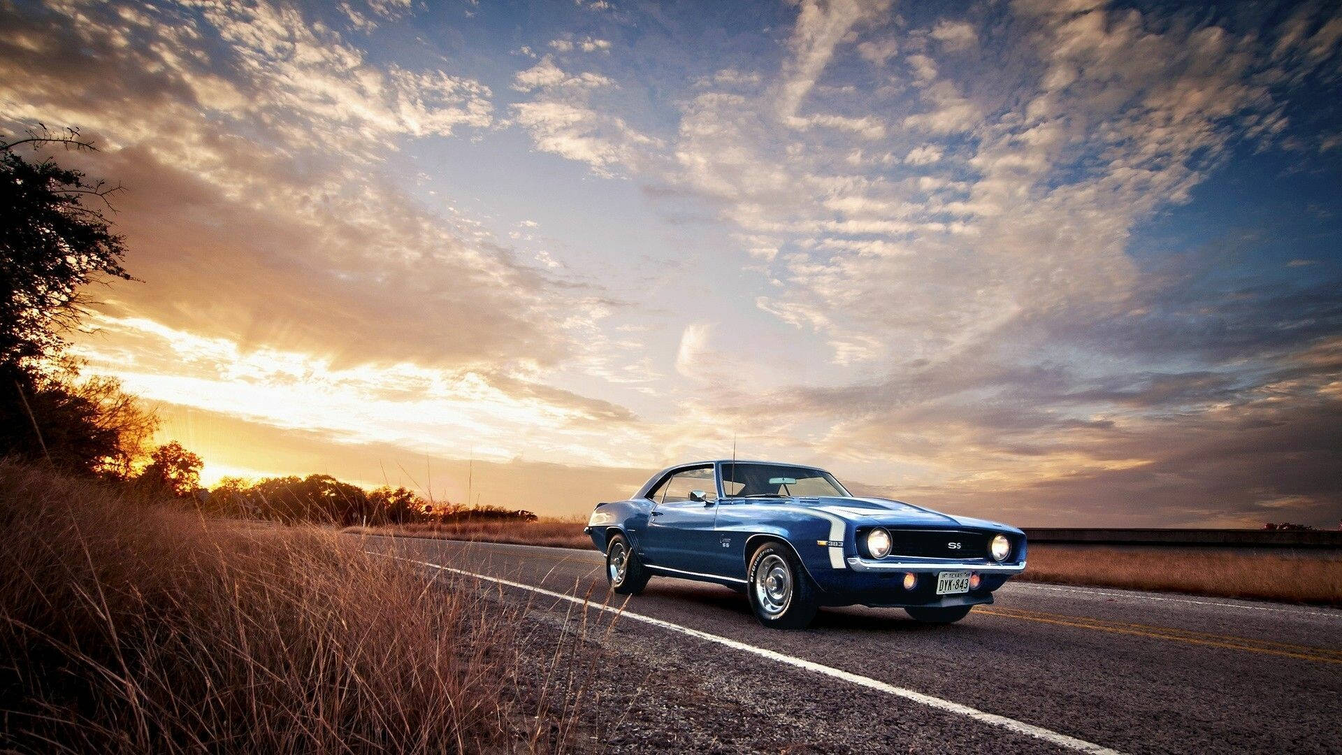 classic blue muscle car, rural road, dramatic sunset sky, Full HD Desktop Wallpaper